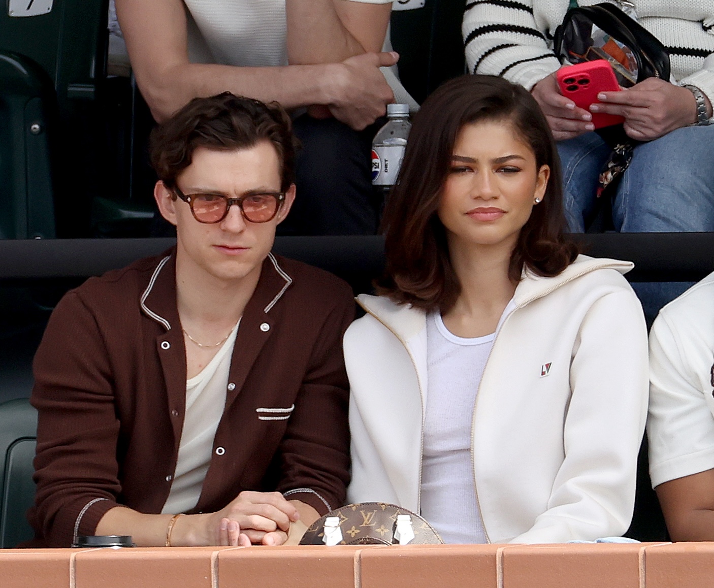 INDIAN WELLS, CALIFORNIA - MARCH 17: Tom Holland and Zendaya watch Carlos Alcaraz of Spain play Daniil Medvedev of Russia during the Men's Final of the BNP Paribas Open at Indian Wells Tennis Garden on March 17, 2024 in Indian Wells, California.