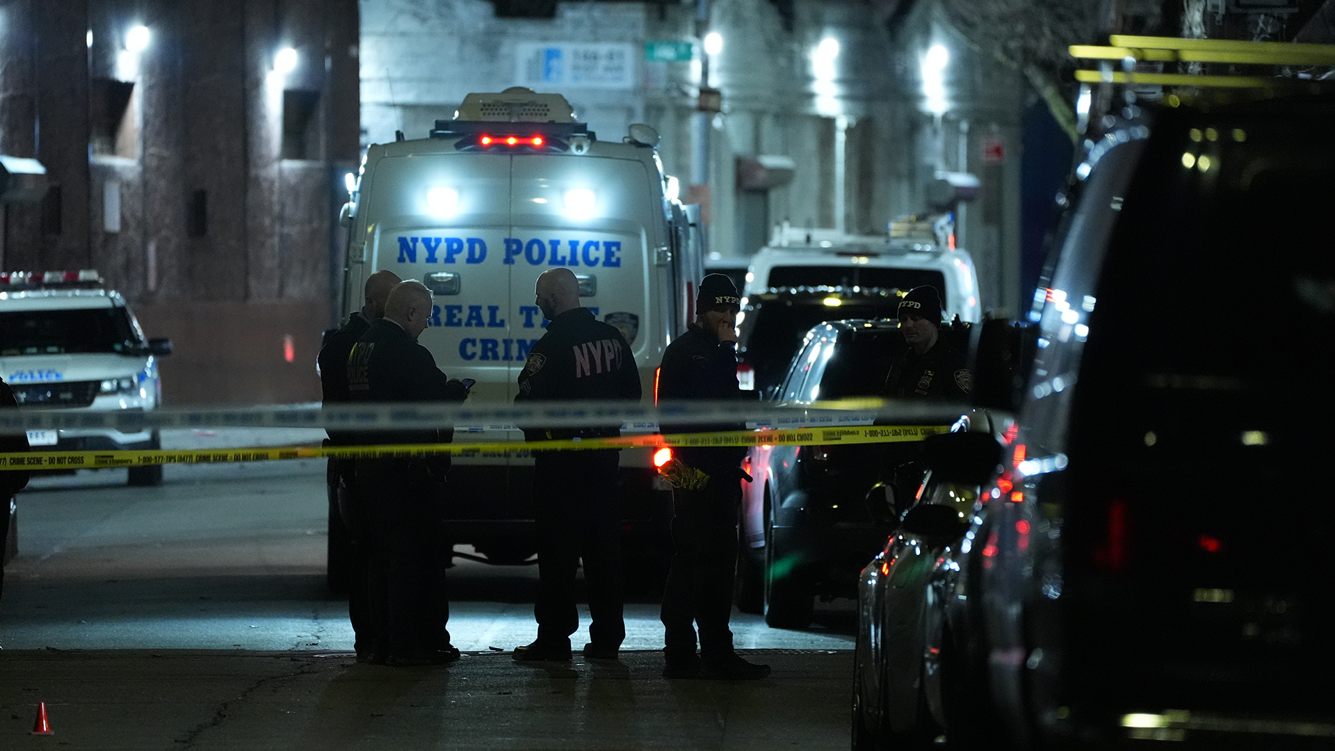 Police officers are investigating at the crime scene.