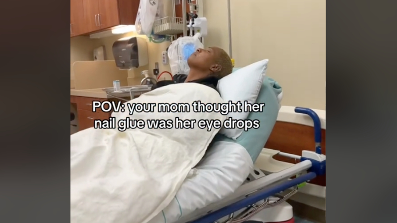 A person is lying on a hospital bed in a medical setting. Text overlay reads, "POV: your mom thought her nail glue was her eye drops."