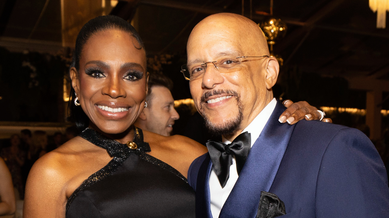 Sheryl Lee Ralph in a black dress and husband Vincent Hughes in a navy suit.