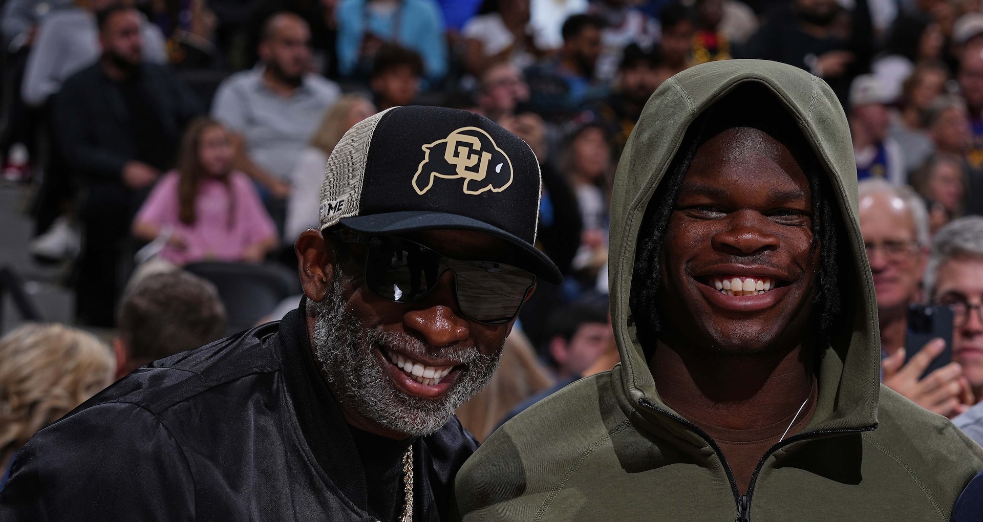 DENVER, CO - OCTOBER 24: Deion Sanders, Travis Hunter, and Sheduer Sanders pose for a photo during the game between the Los Angeles Lakers and the Denver Nuggets on October 24, 2023 at the Ball Arena in Denver, Colorado.