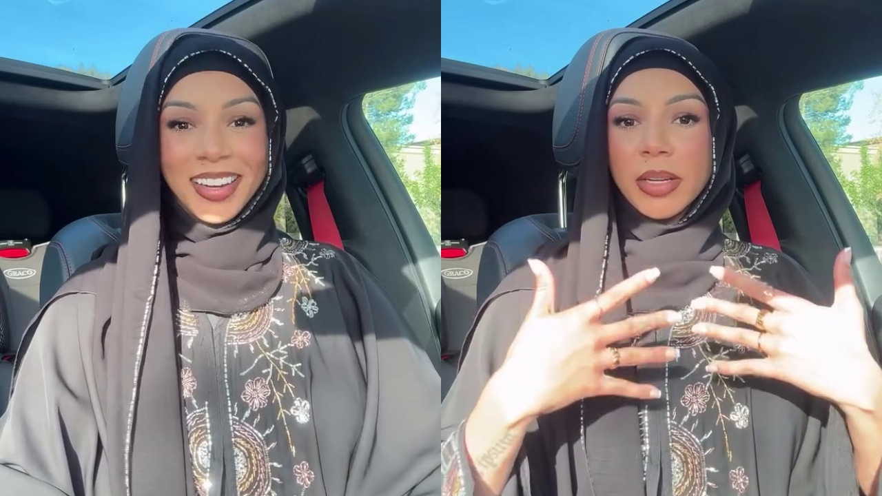 Brittany Renner wearing a black hijab and embellished clothing is sitting in a car, speaking and gesturing with her hands.