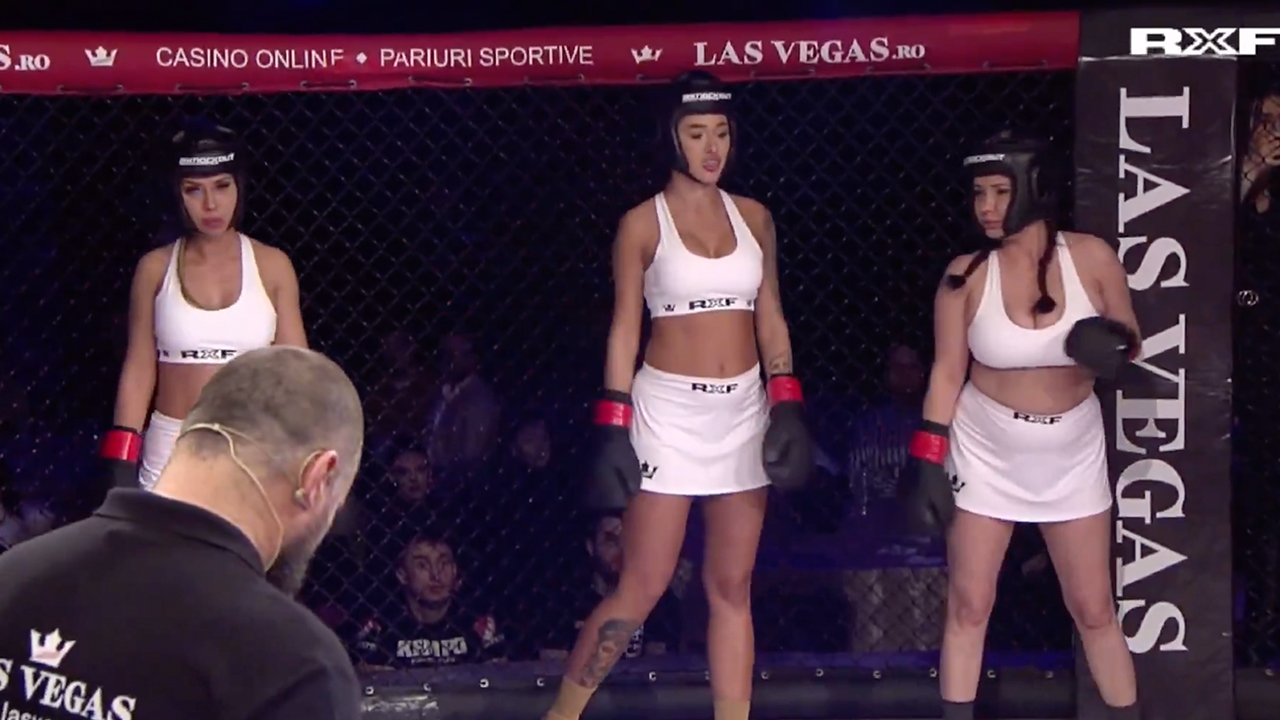 Three women gearing up for an MMA fight.