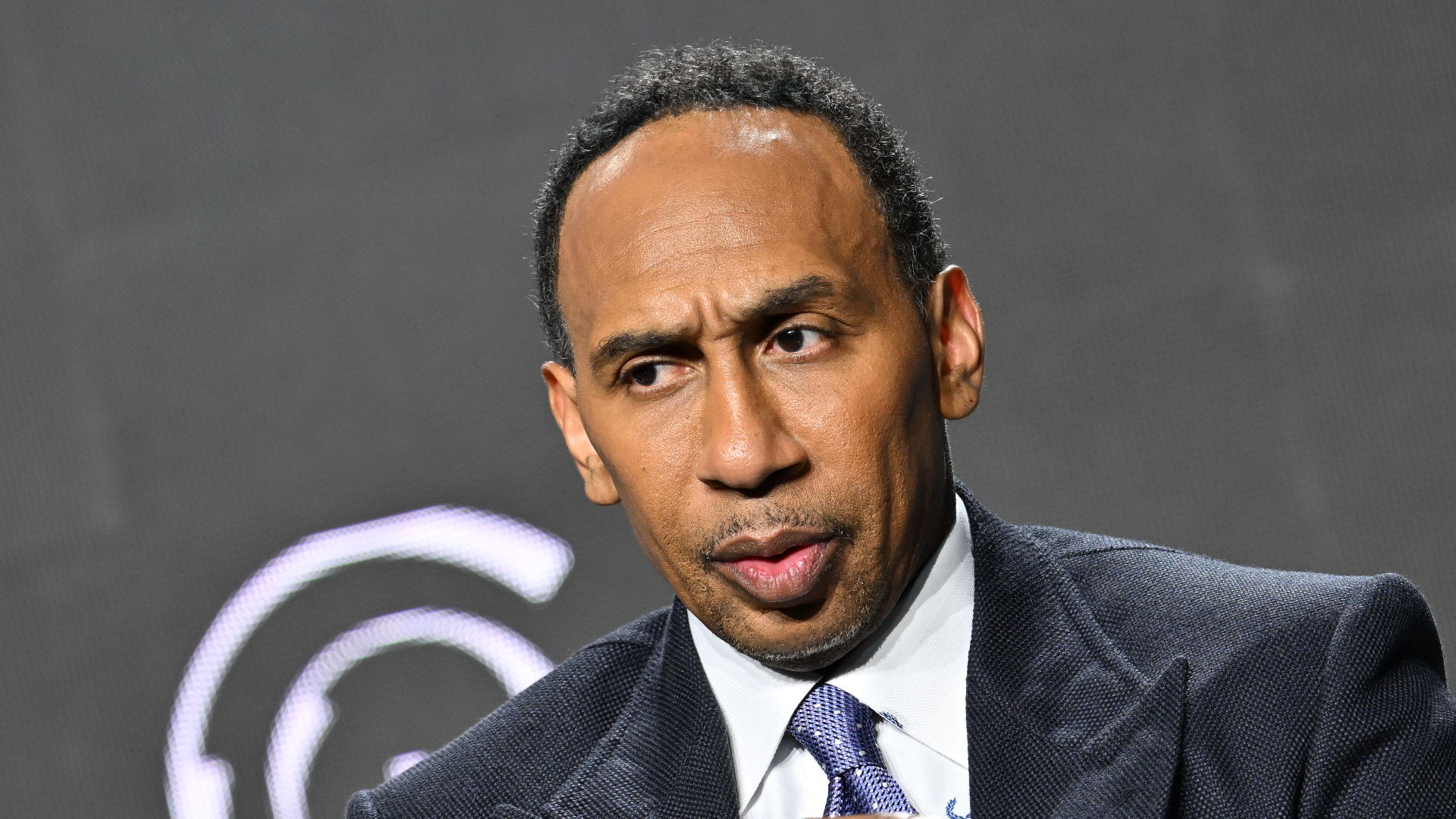 Stephen A. Smith speaking at an event.