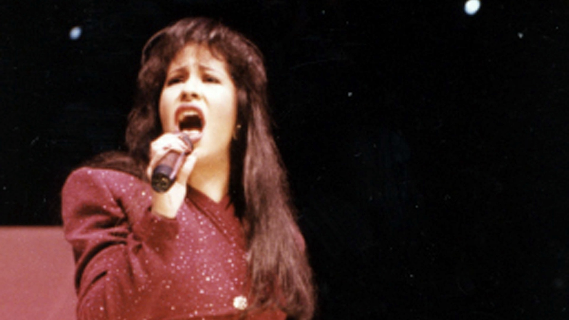 American singer Selena (born Selena Quintanilla-Perez, 1971 - 1995) performs onstage during the Houston Livestock Show & Rodeo at the Houston Astrodome, Houston, Texas, February 26, 1995. The performance was her last before her murder the following month.