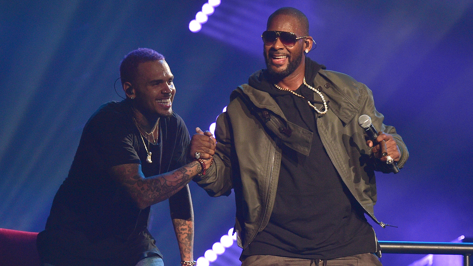 Chris Brown and R. Kelly perform at Phillips Arena on March 2, 2015, in Atlanta, Georgia.