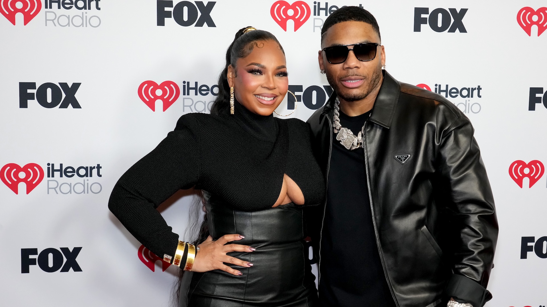 HOLLYWOOD, CALIFORNIA - MARCH 17: (L-R) Ashanti and Nelly attend the 2025 iHeartRadio Music Awards at Dolby Theatre on March 17, 2025 in Hollywood, California.