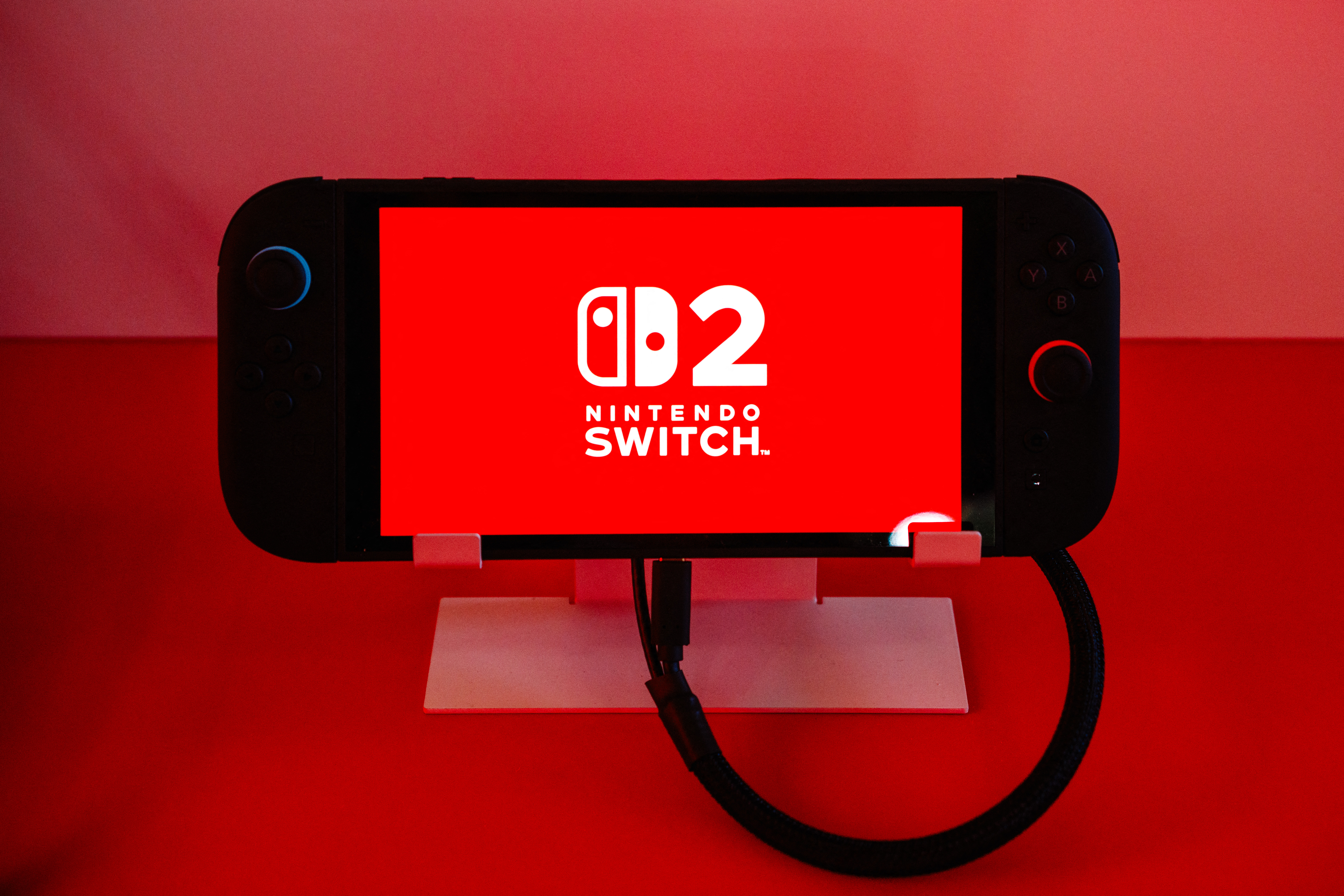 This photograph shows a Nintendo Switch 2 video-game console system of Japanese video-game company Nintendo, displayed during the worldwide presentation at the Grand Palais in Paris on April 2, 2025. Japanese video game giant Nintendo announced on April 2, 2025, that the new version of its Switch console would be launched on June 5, 2025. The Kyoto-based company also revealed new features for the Switch 2 -- an update to the 2017 original model -- including a new chat button that allows players to speak with each other while playing.