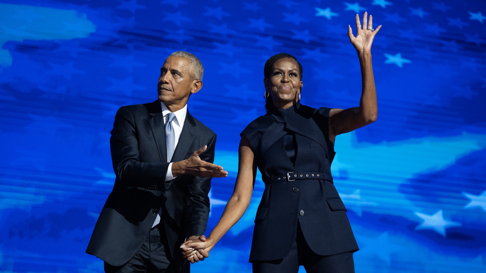 UNITED STATES - AUGUST 20: Former President Barack Obama and former first lady Michelle Obama appear on stage in between their addresses on the second night of the Democratic National Convention at the United Center in Chicago, Ill., on Tuesday, August 20, 2024.