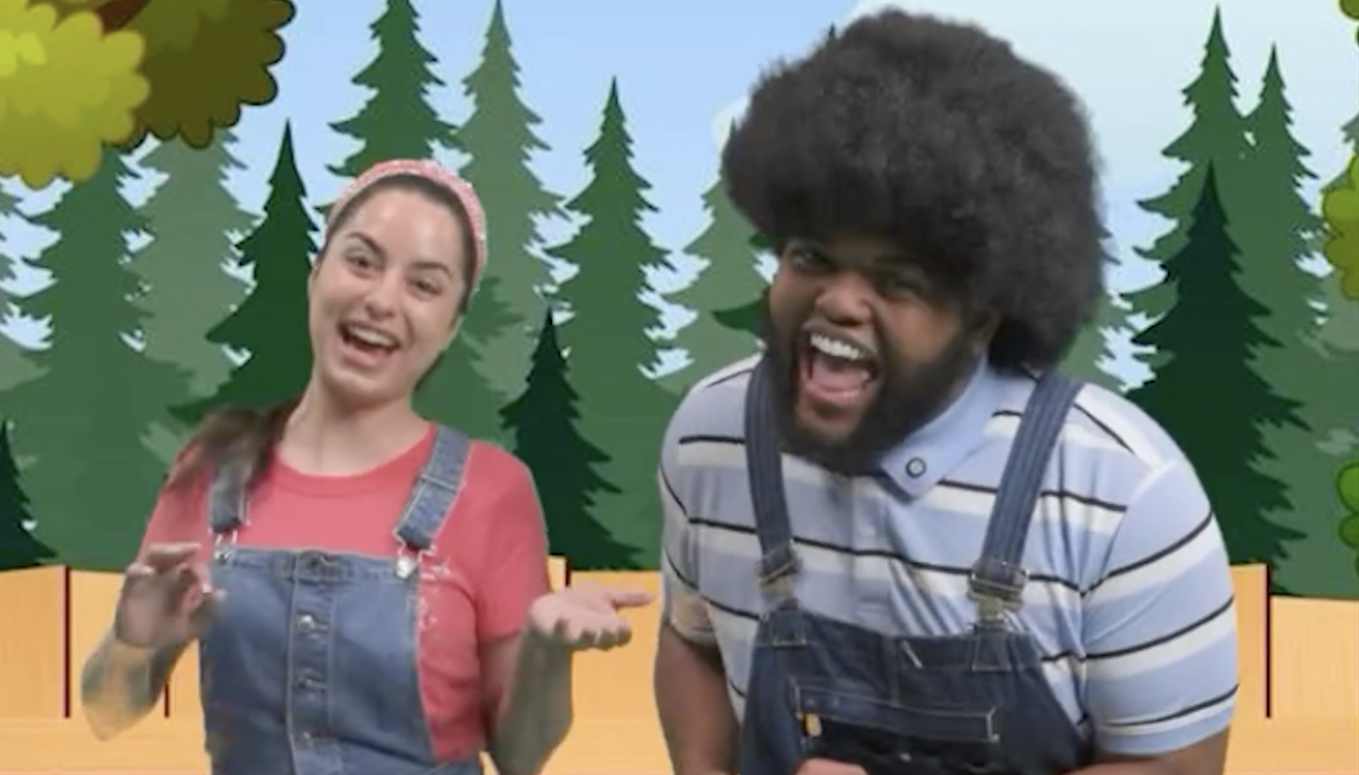 Two people in overalls smiling, standing in front of a cartoon forest background. The woman wears a pink shirt and headband; the man has an afro.