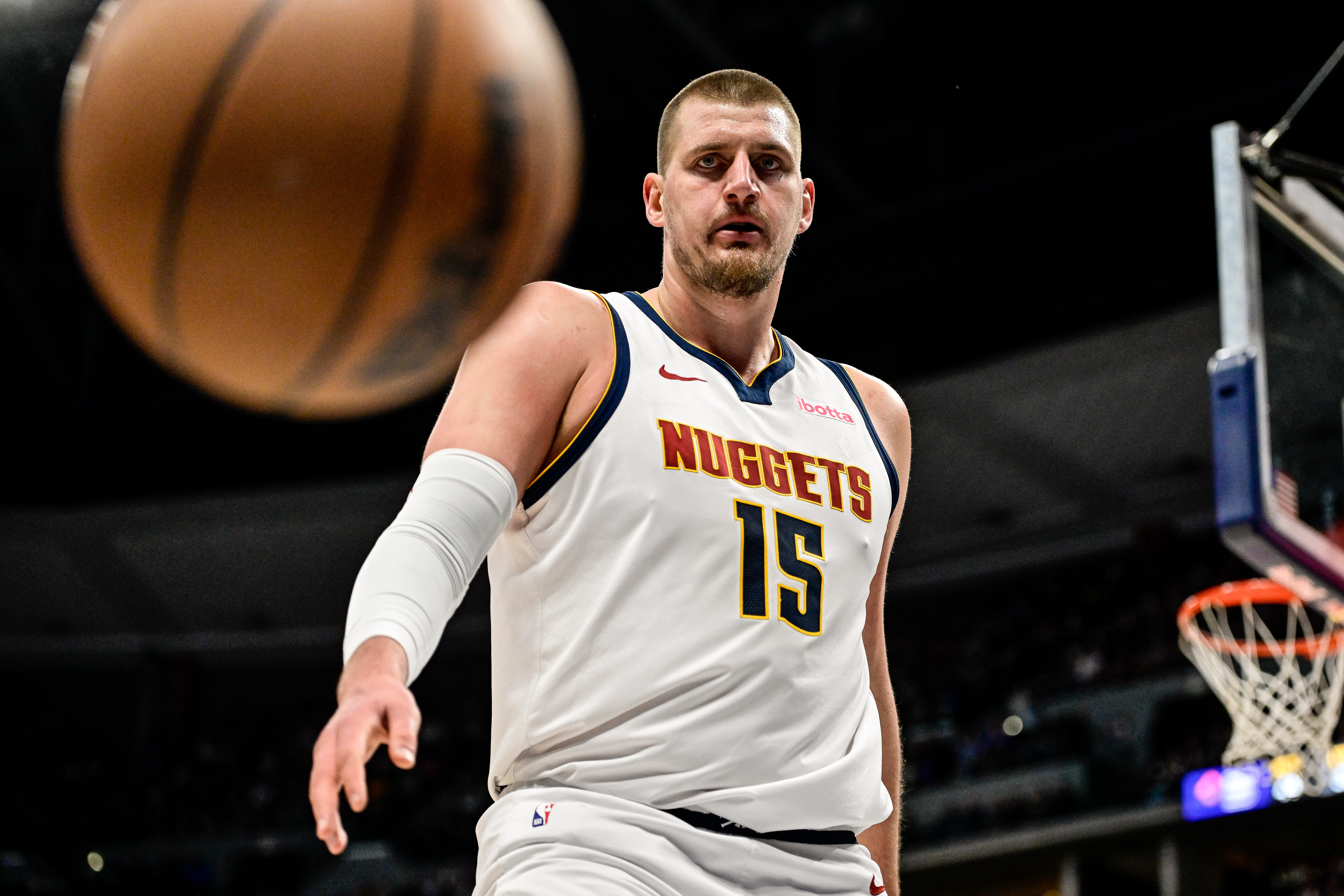 DENVER, COLORADO - MARCH 15: Nikola Jokic #15 of the Denver Nuggets watches a loose ball go out of bounds in the first half against the Washington Wizards at Ball Arena on March 15, 2025 in Denver, Colorado.