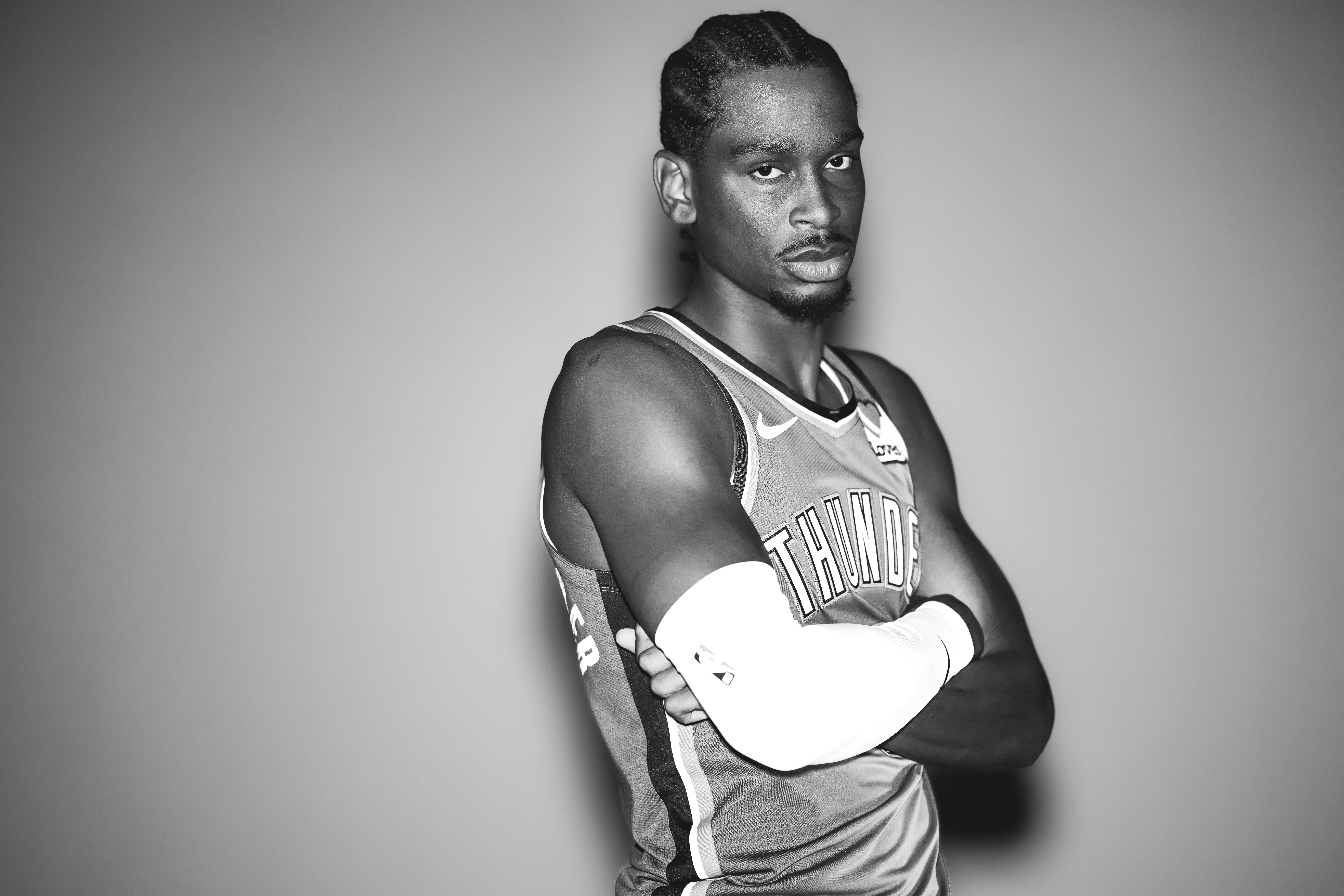 OKLAHOMA CITY, OKLAHOMA - SEPT 30: (EDITOR'S NOTE: This image was converted to black and white) Shai Gilgeous-Alexander #2 of the Oklahoma City Thunder poses for a portrait during 2024 NBA Media Day on September 30, 2024 at the Paycom Center in Oklahoma City, Oklahoma. 