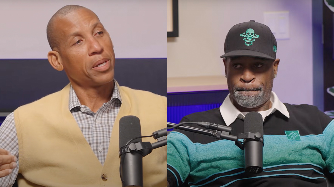 Reggie Miller and Stephen Jackson in a podcast studio, both speaking into microphones. Reggie wears a yellow vest, and Stephen wears a hat.