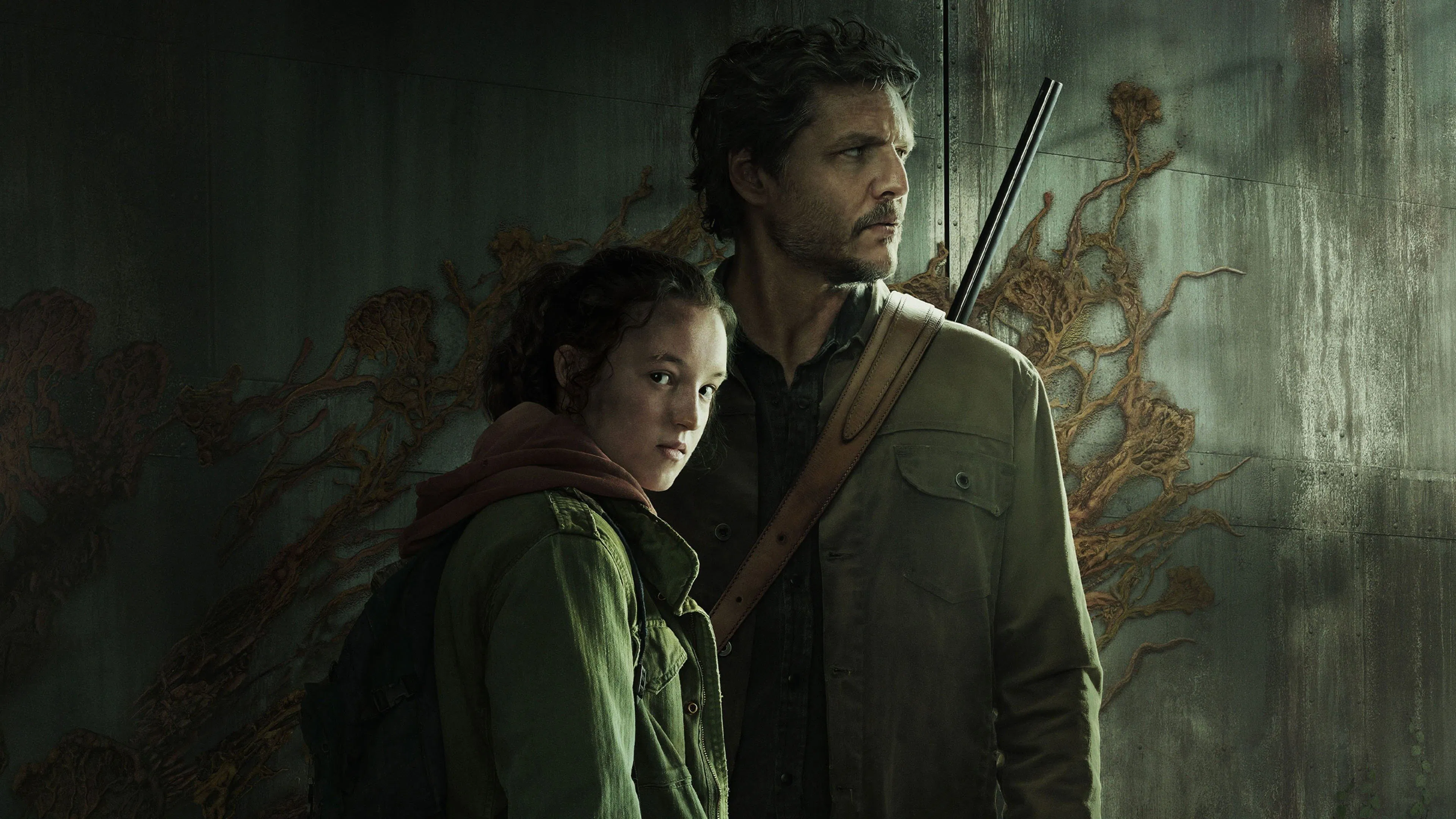 A man and a young person stand closely, looking serious, with a dark, textured background. The man holds a rifle.