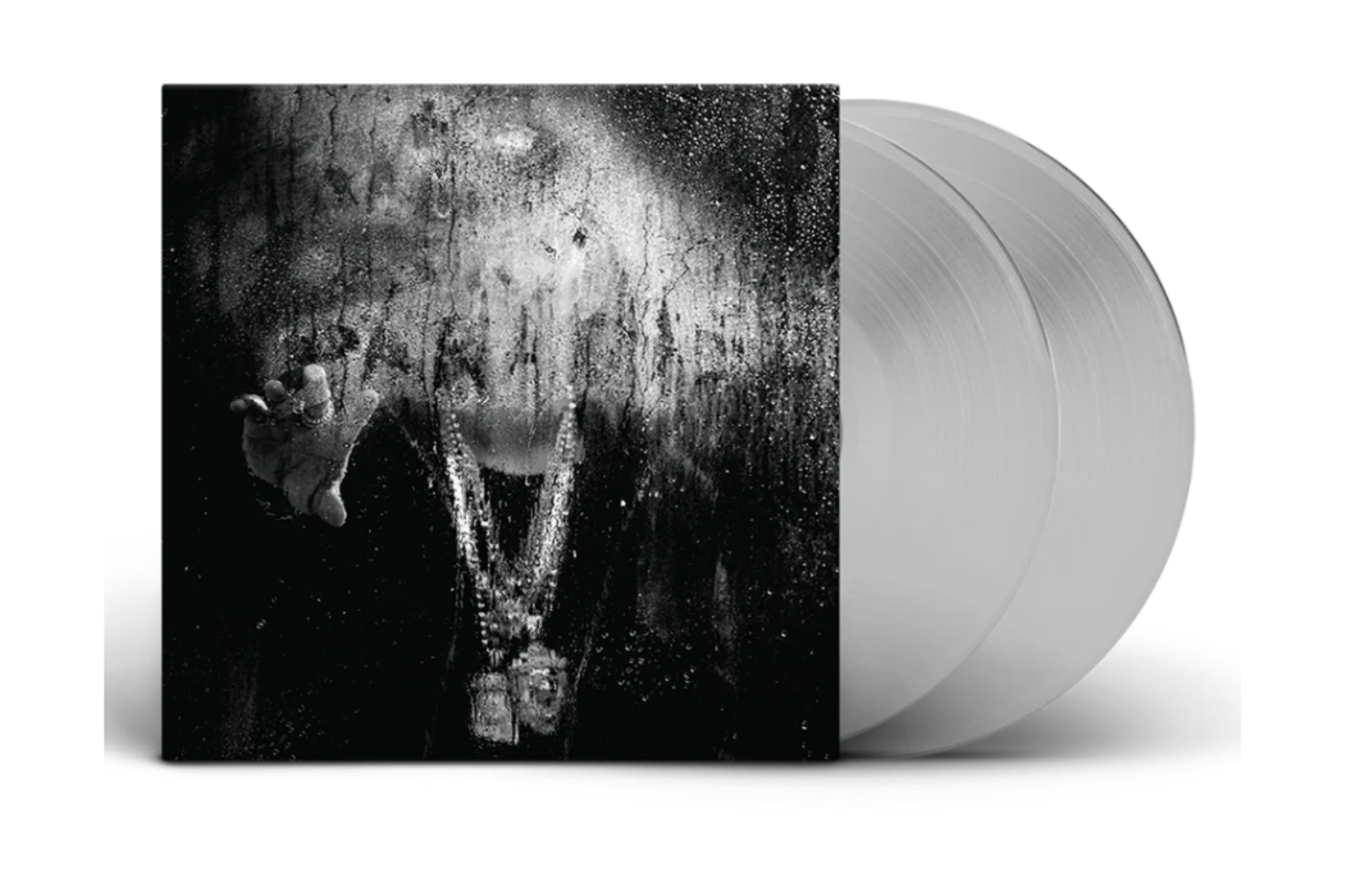 Big Sean's "Dark Sky Paradise" album cover with a black and white blurred figure behind a wet glass, adorned with heavy chains. Two clear vinyl records are shown.