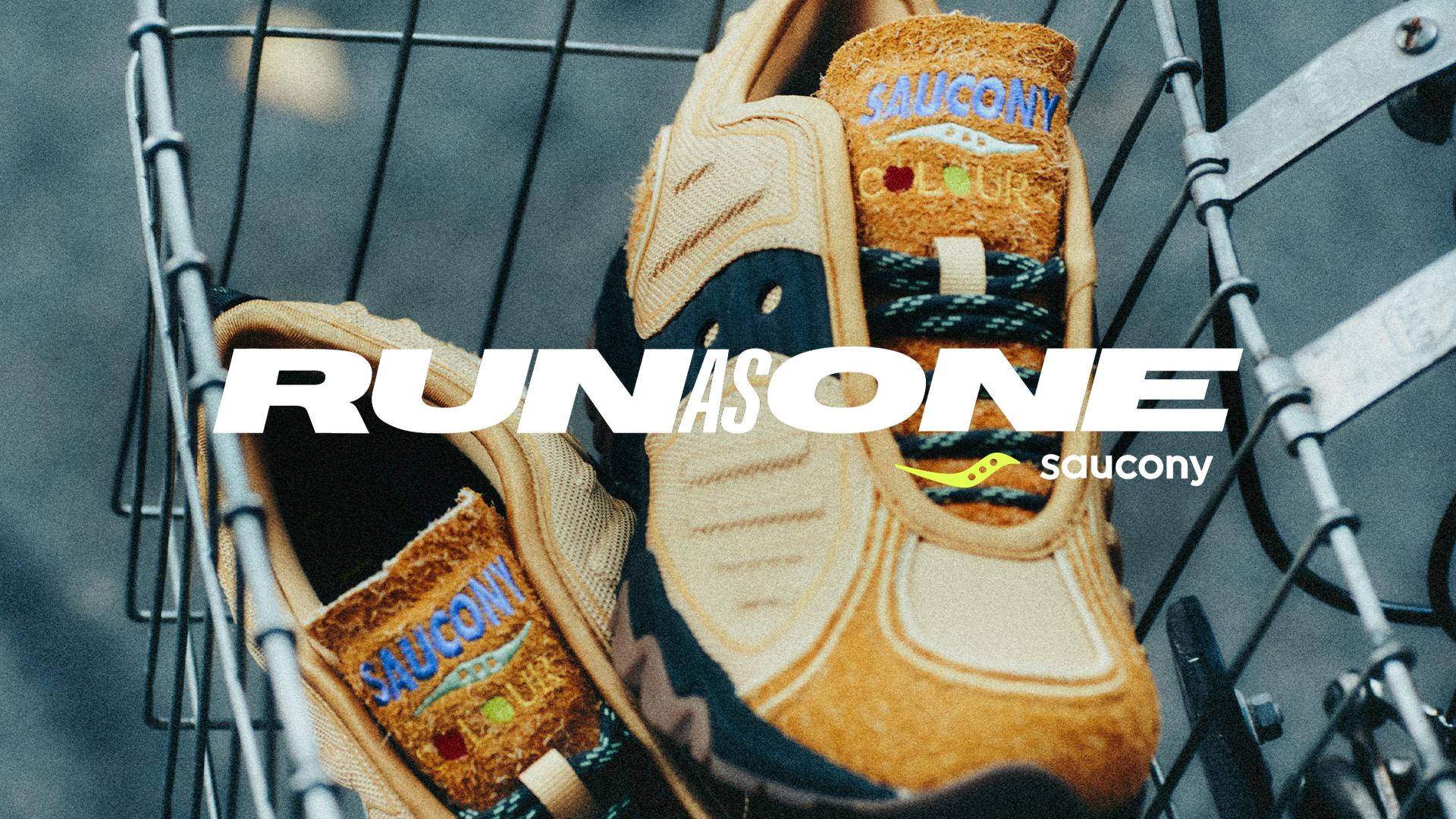 A pair of Saucony sneakers in a shopping cart, with "RUN AS ONE" text overlay.