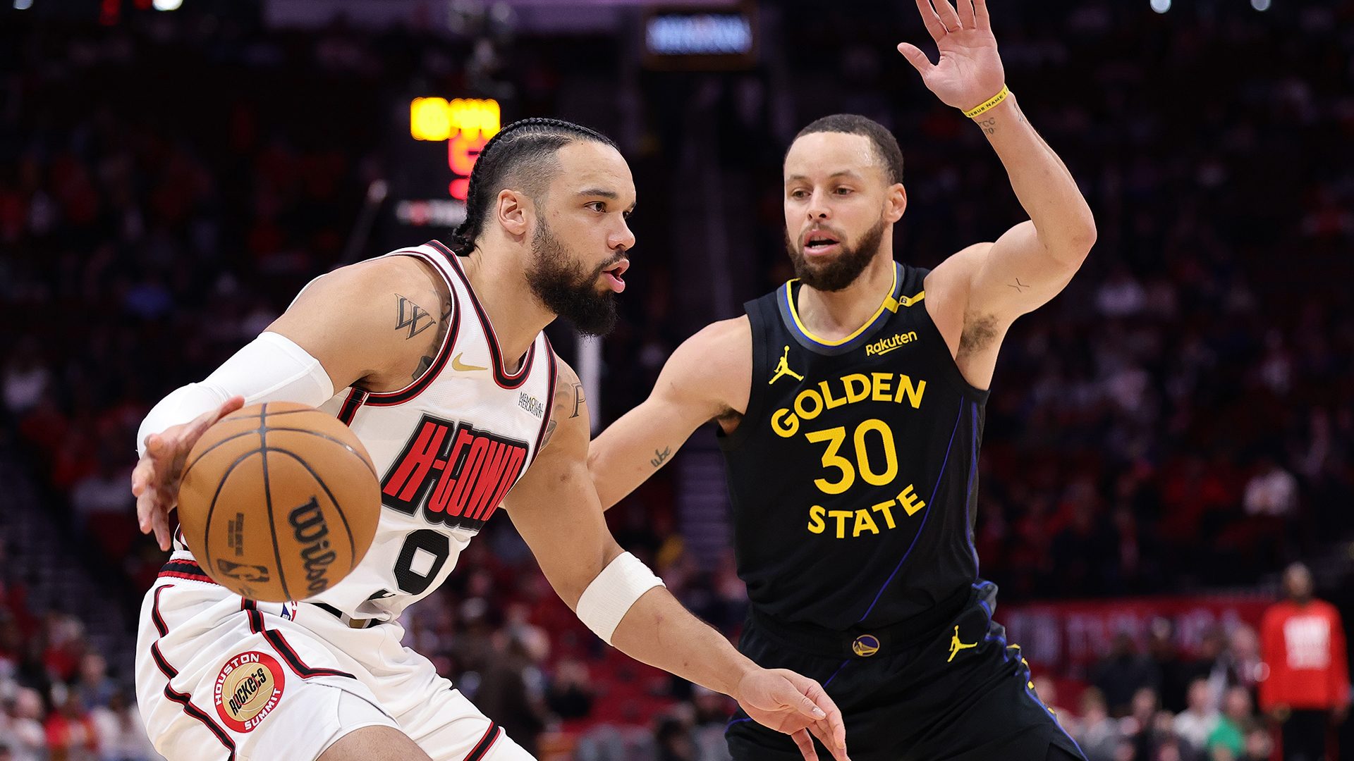 Dillon Brooks of the Houston Rockets with Steph Curry of the Golden State Warriors.
