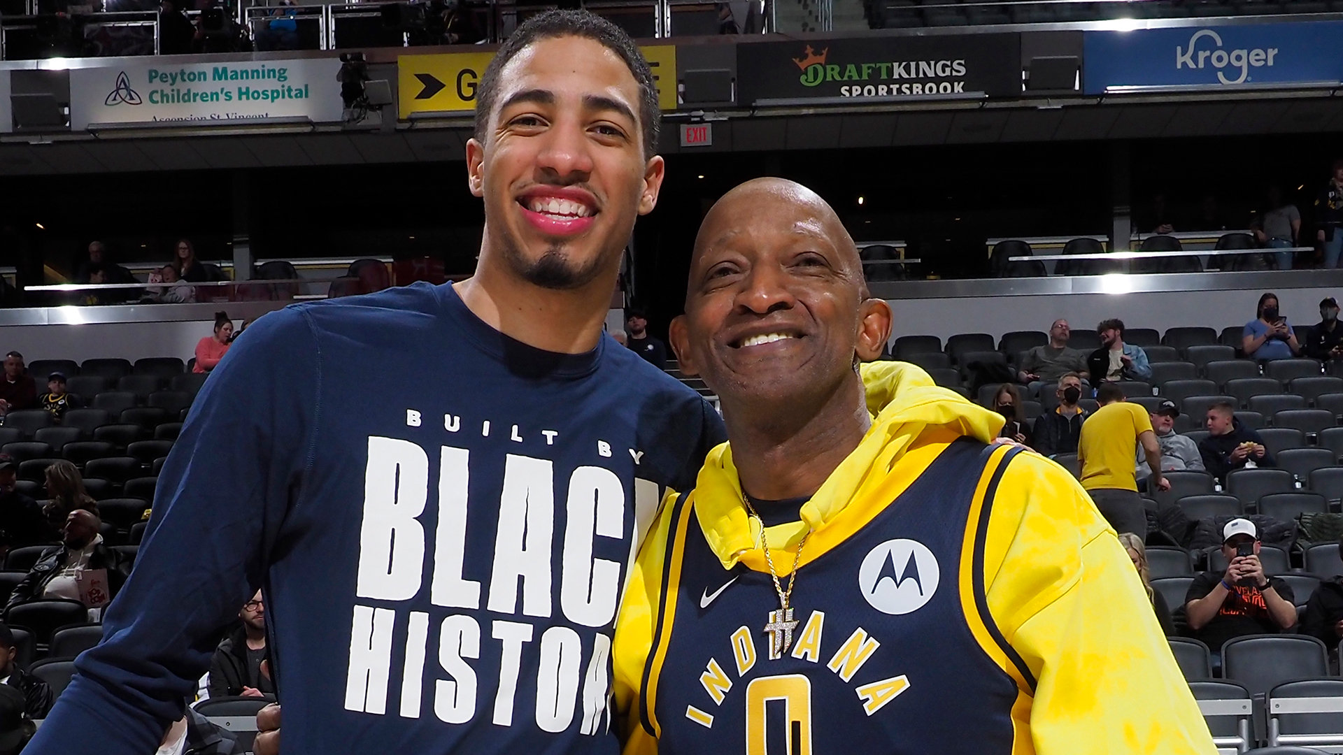 Tyrese Haliburton #0 of the Indiana Pacers and his father, John Haliburton, pose for a photograph prior to a game.