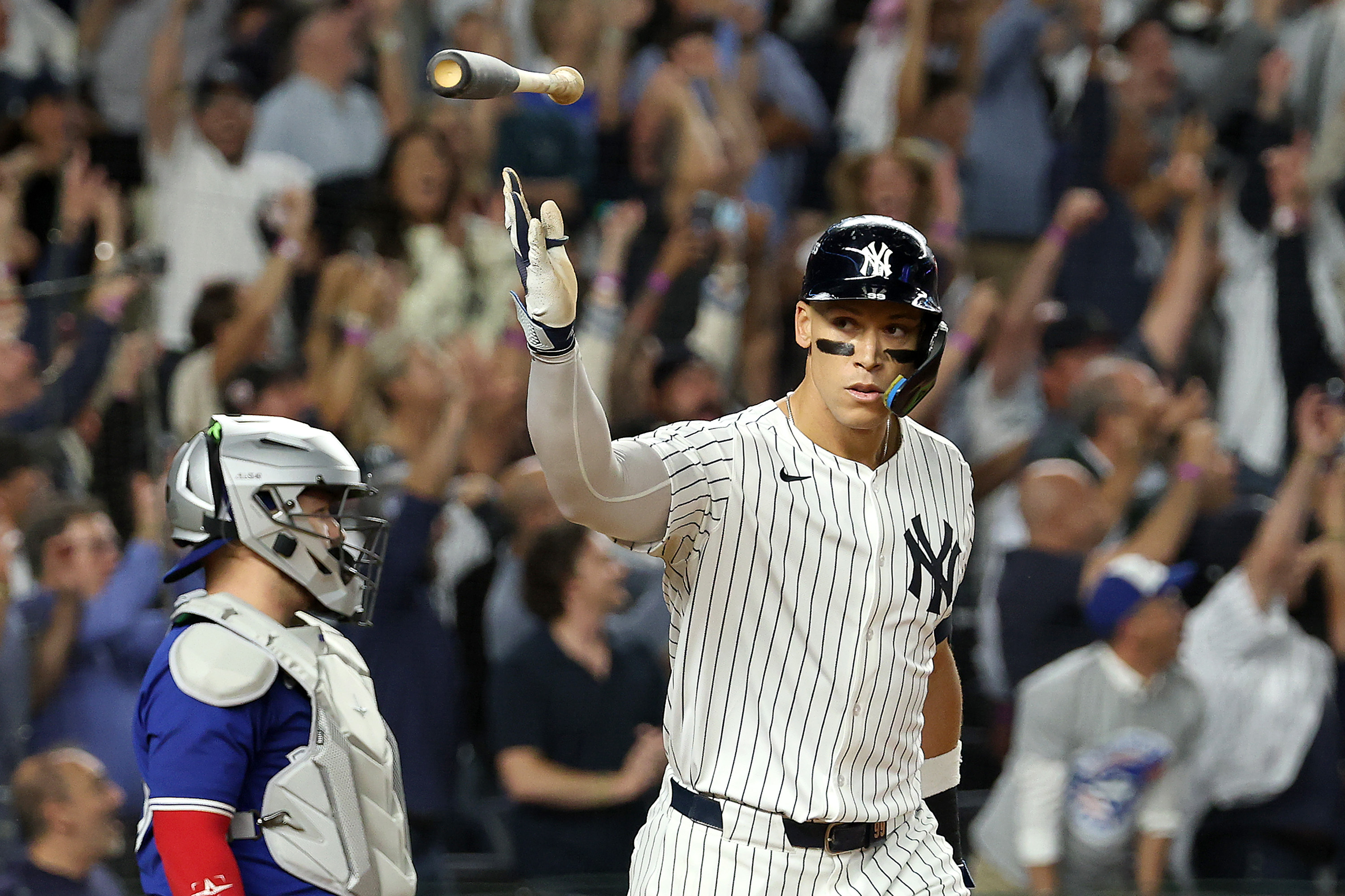 Aaron Judge tosses his bat after hitting a home run against the Toronto Blue Jays. 