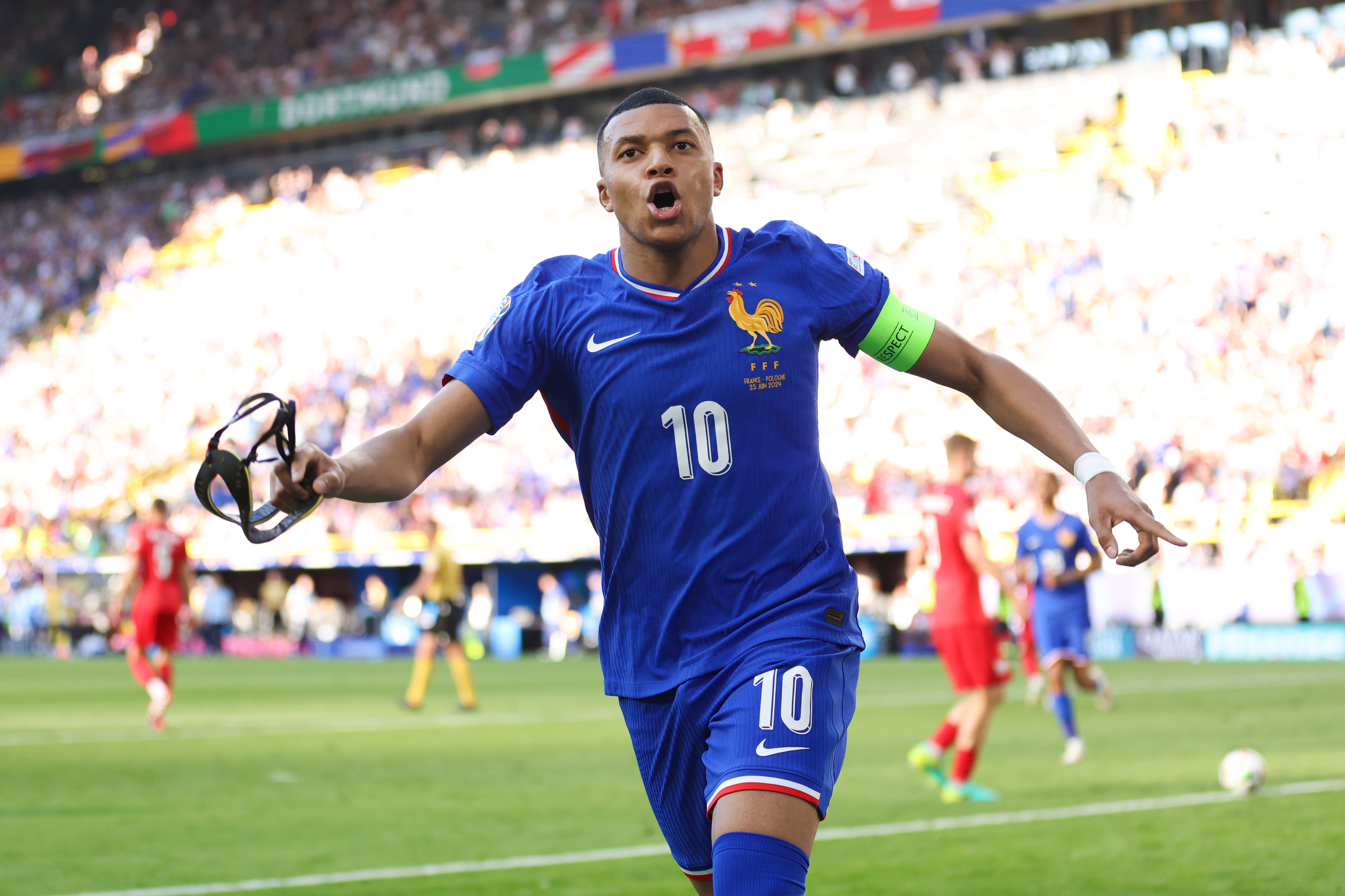 Kylian Mbappe celebrates after scoring a goal for France. 