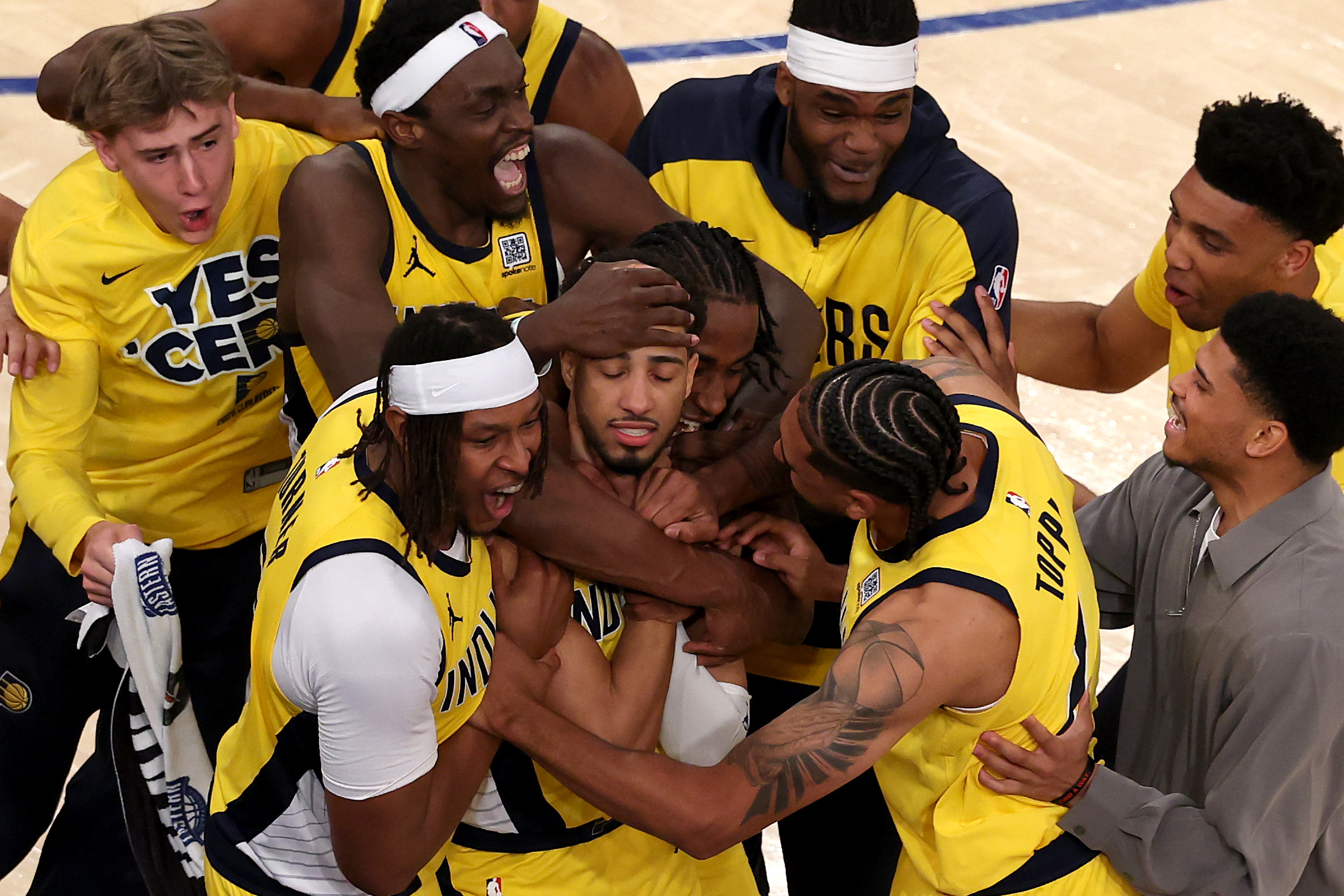 The Pacers mob Tyrese Haliburton after he sends Game 1 of the Eastern Conference Finals into overtime. 
