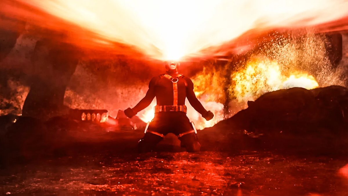 A superhero, likely Cyclops, emits a powerful red energy beam from his eyes amidst a fiery, chaotic background.