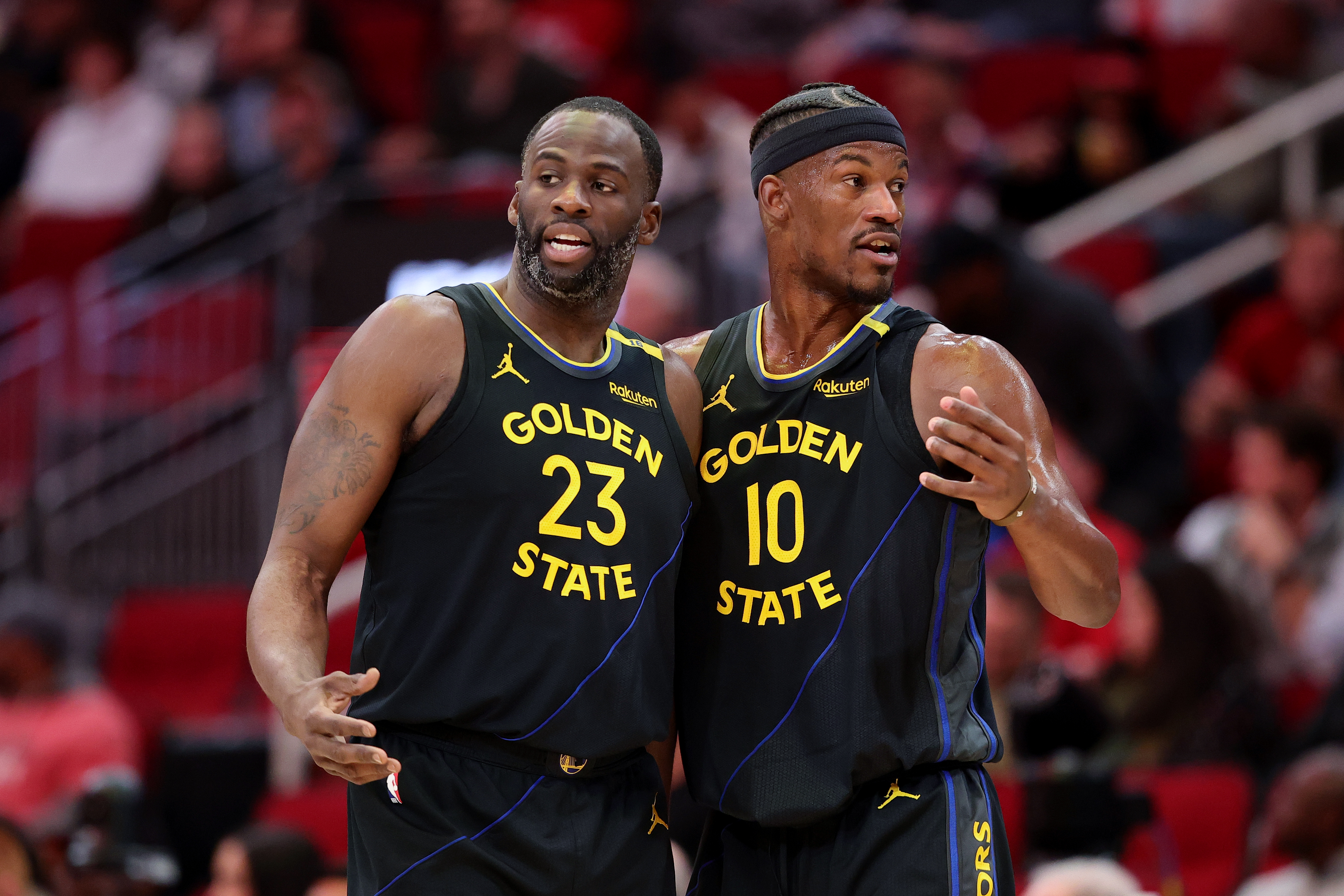 Draymond Green and Jimmy Butler talk during a Warriors-Rockets game in February 2025.