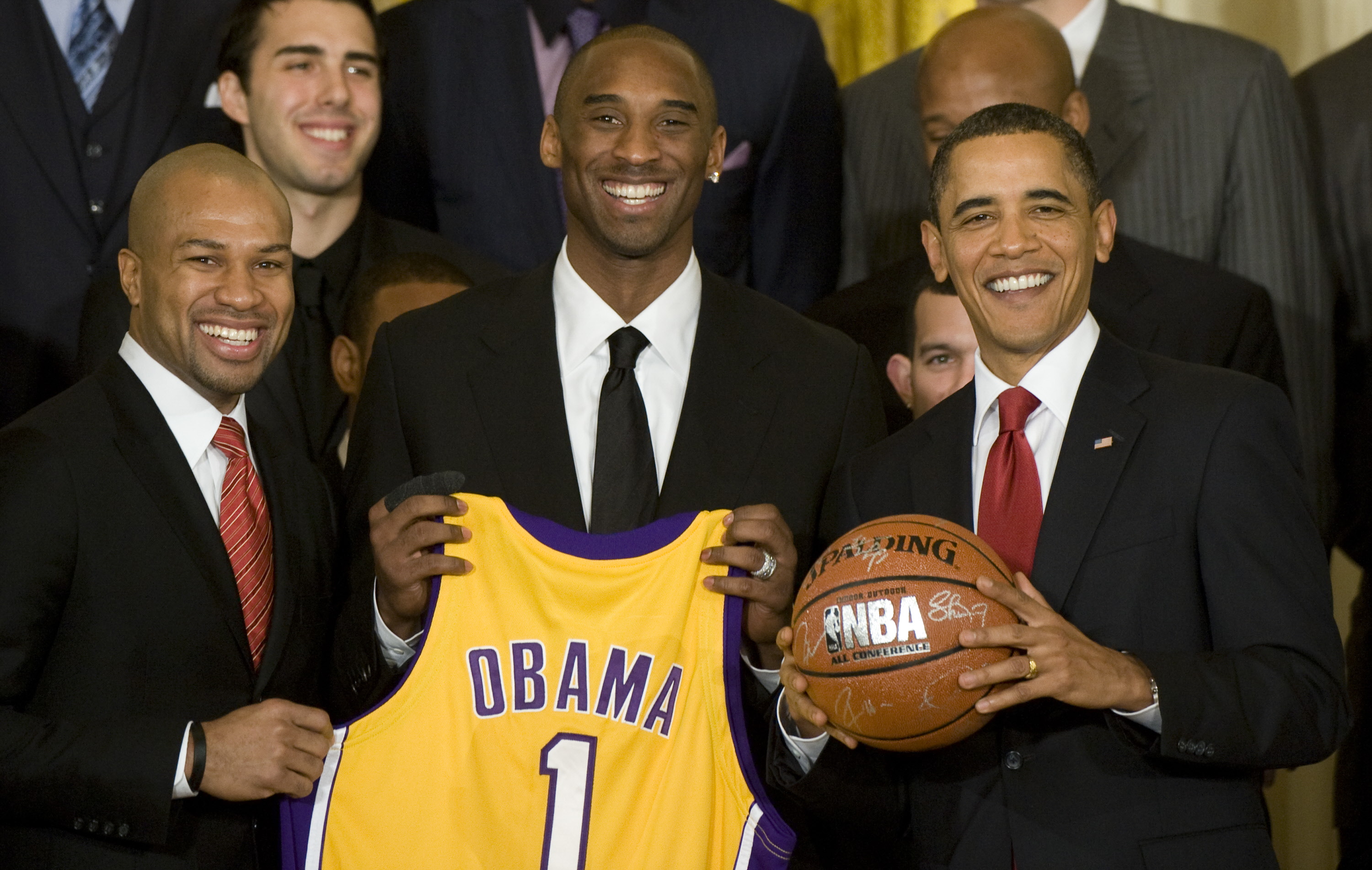 Kobe Bryant and Derek Fisher present President Barack Obama with a custom Lakers jersey during the Lakers' visit to the White House.