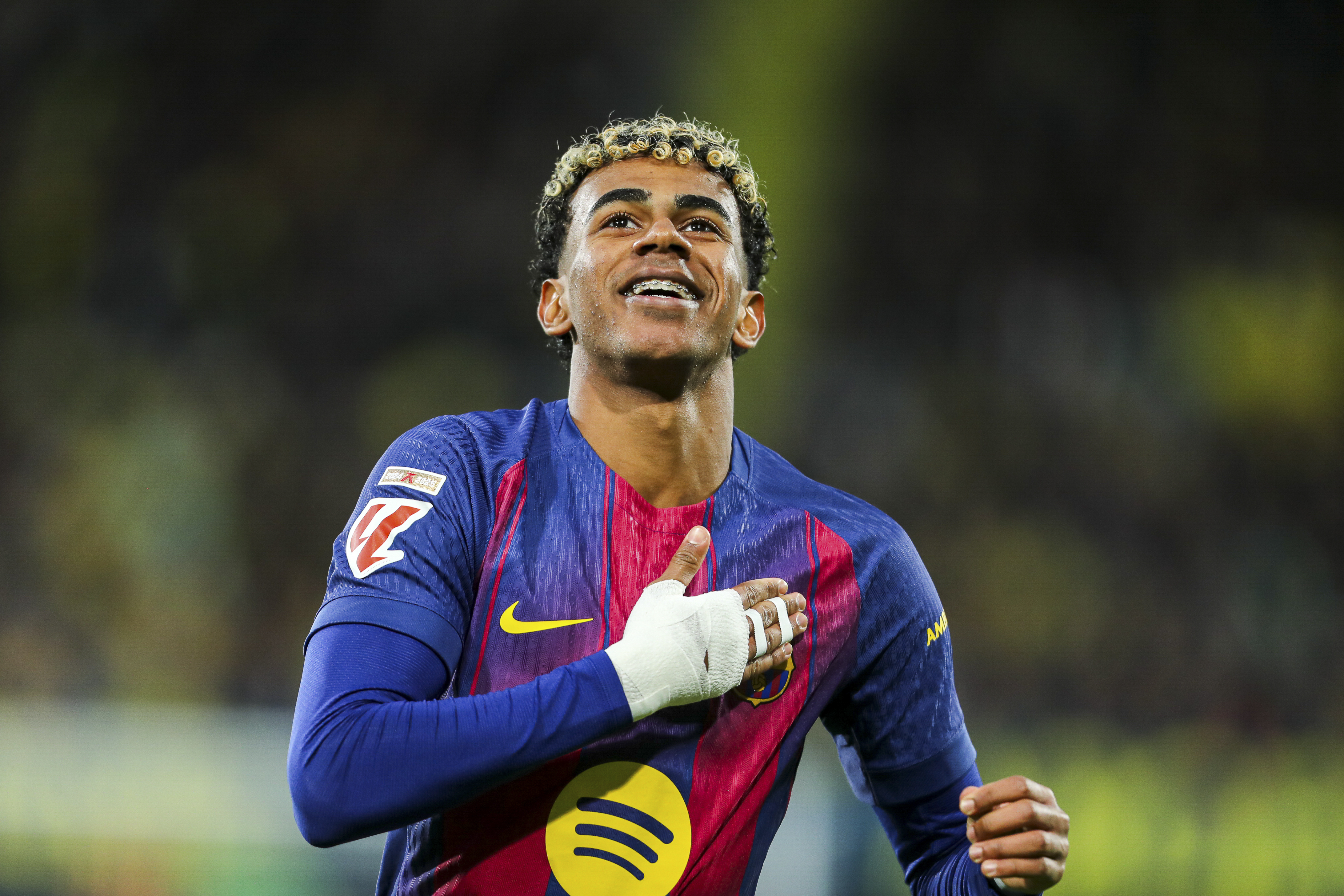 Lamine Yamal celebrates a goal during a Barcelona match in December 2025. 