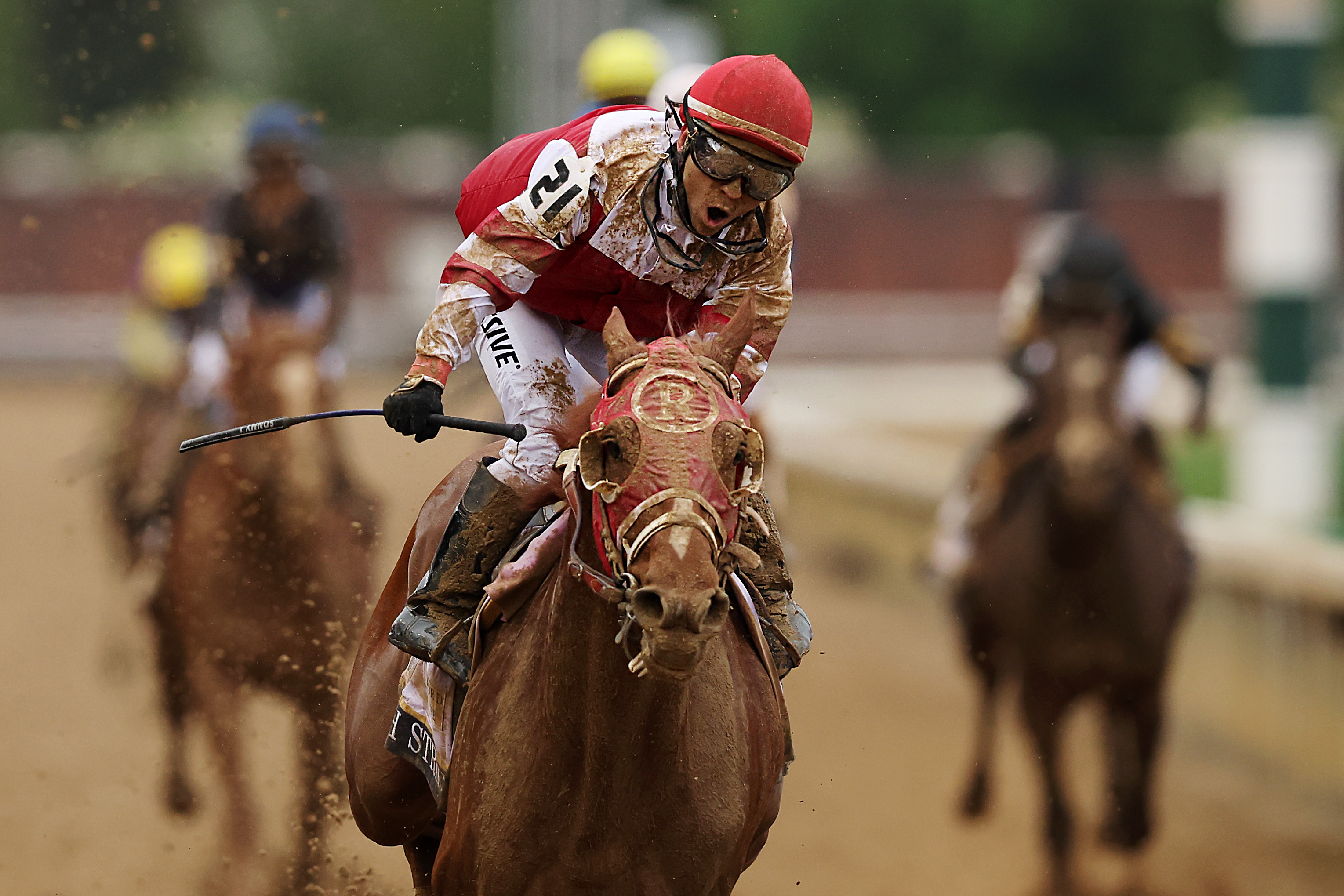 Jockey Sonny Leon rides Rich Strike to the winners circle at the 2022 Kentucky Derby.