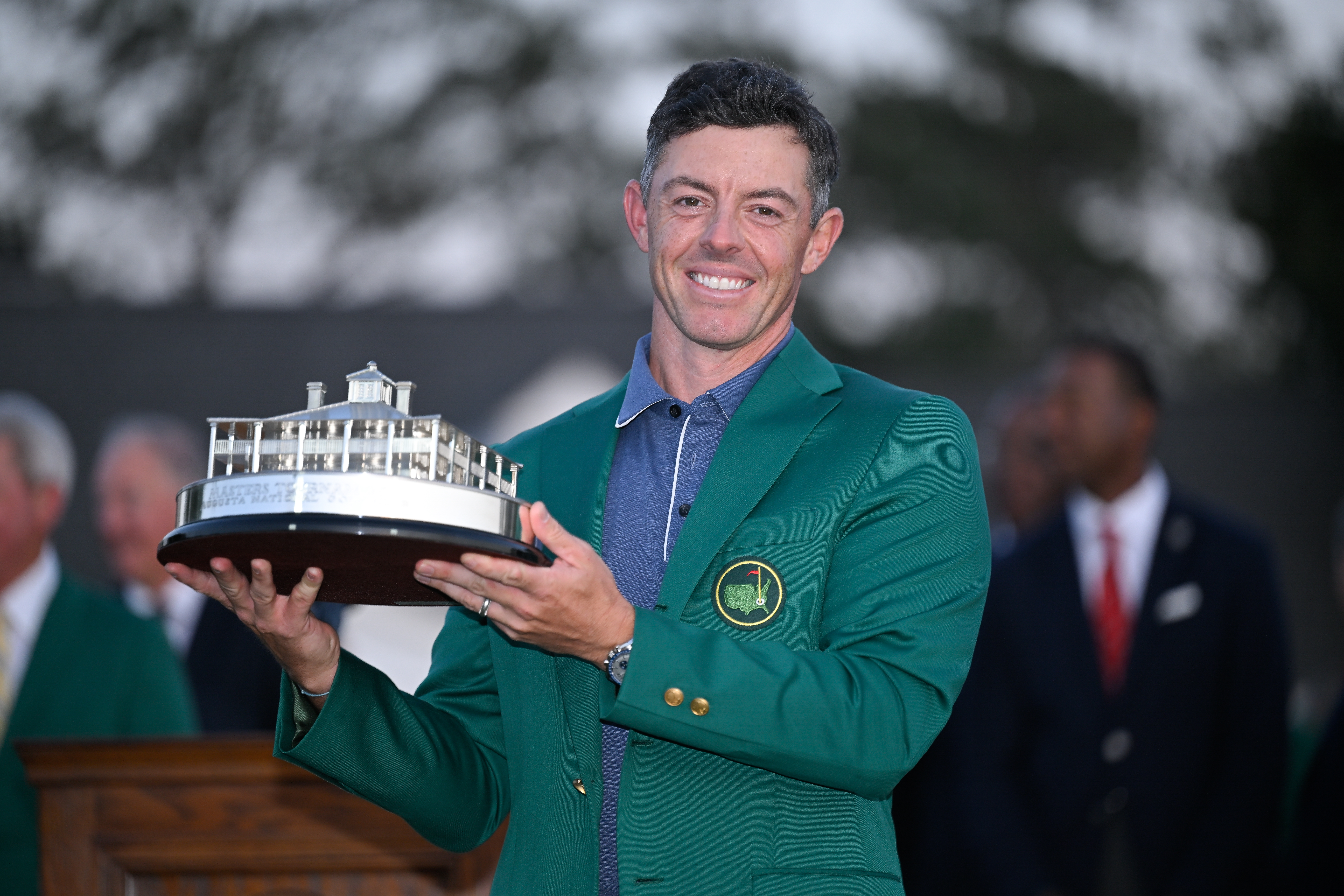 Rory McIlory poses with the Masters trophy after winning the 2025 tournament.