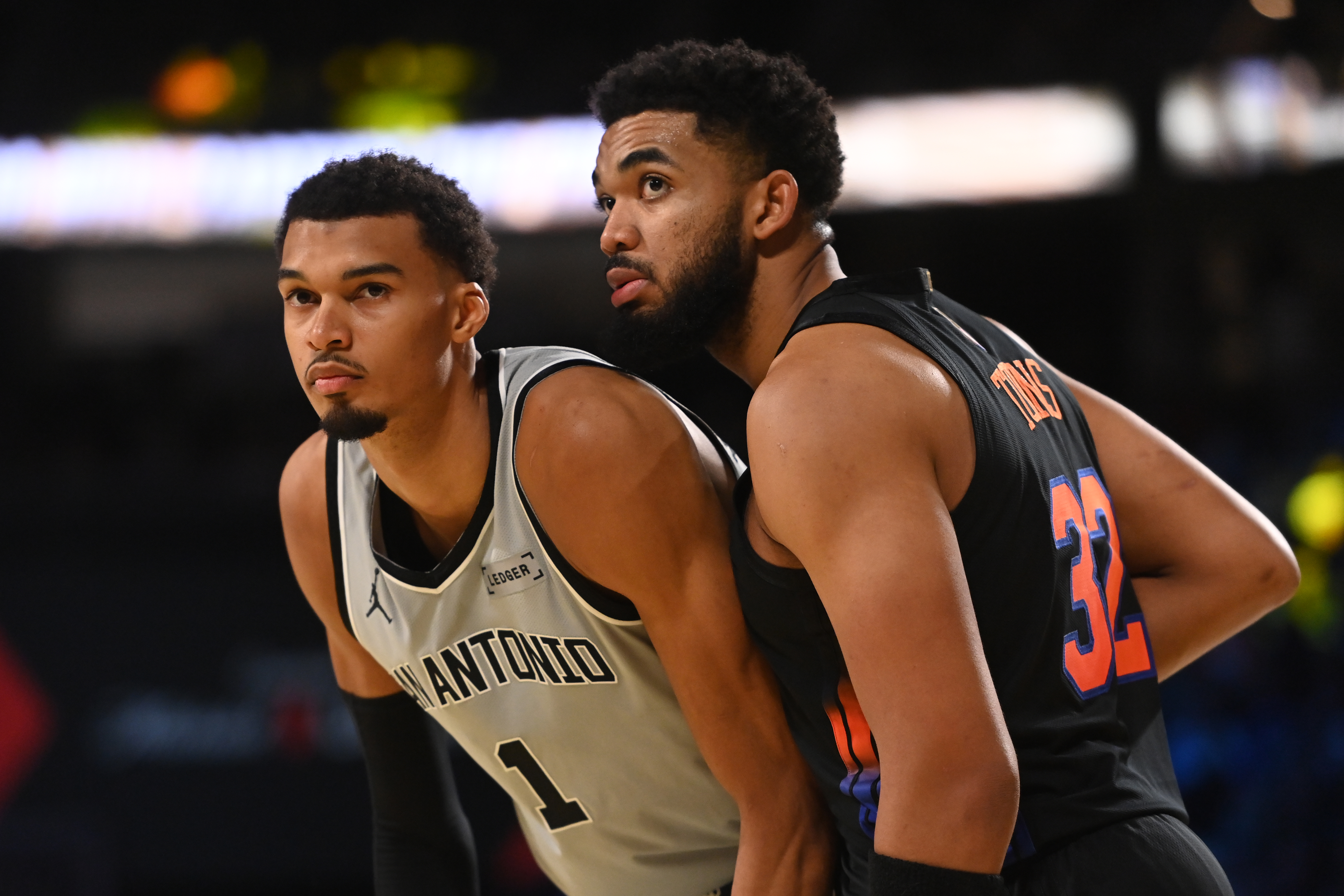 Victor Wembanyama and Karl-Anthony Towns battle for position during the Emirates Cup Final between the Knicks and Spurs in December 2025. 