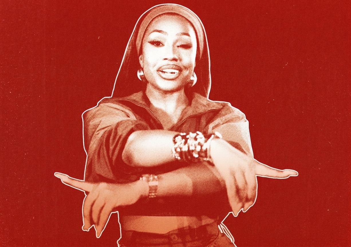 Yung Miami in a red-toned image, wearing a headscarf and jewelry, with arms crossed in a dynamic pose. She has one of the songs of the summer