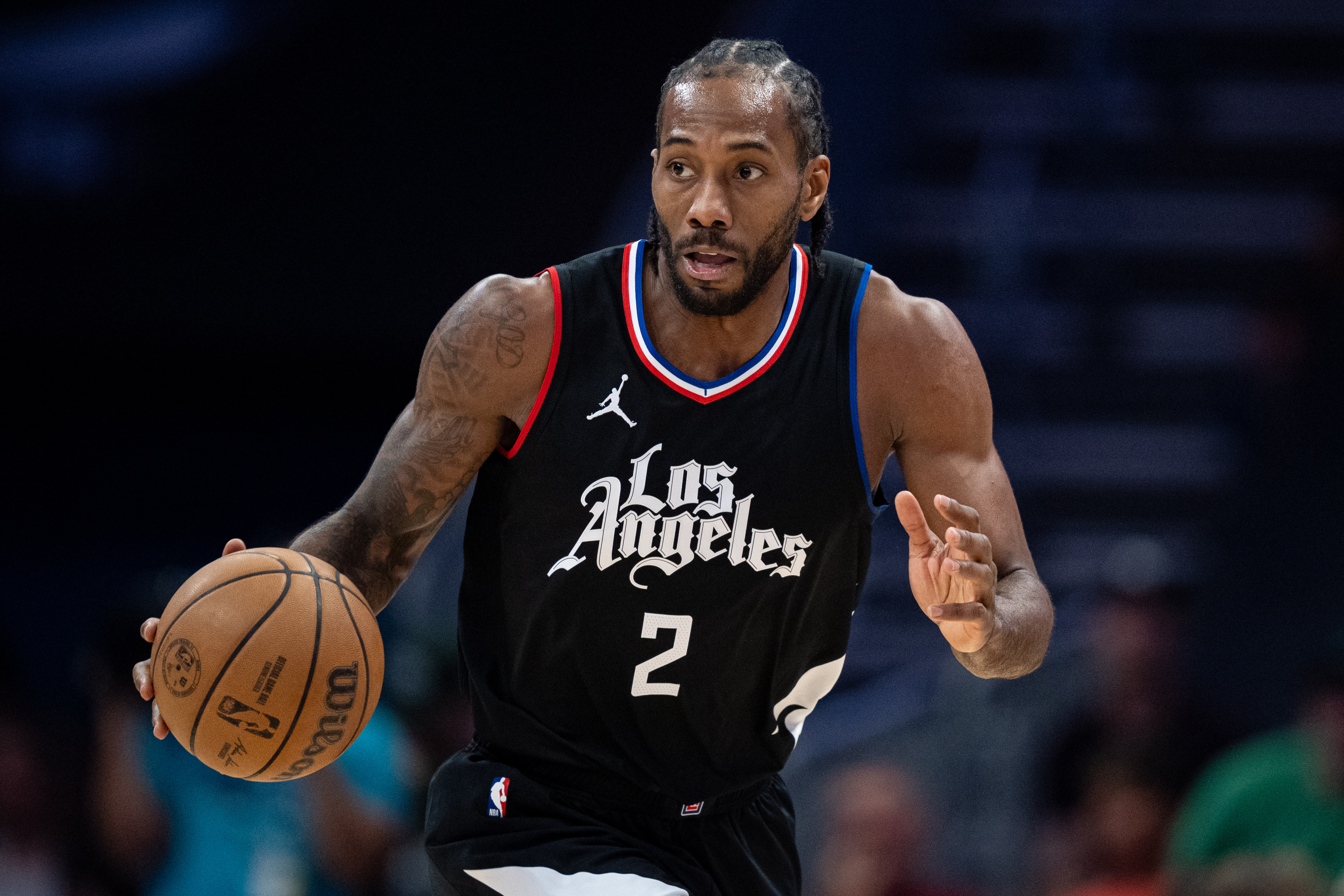 Kawhi Leonard dribbles up the court during a Los Angeles Clippers-Charlotte Hornets game from 2025.