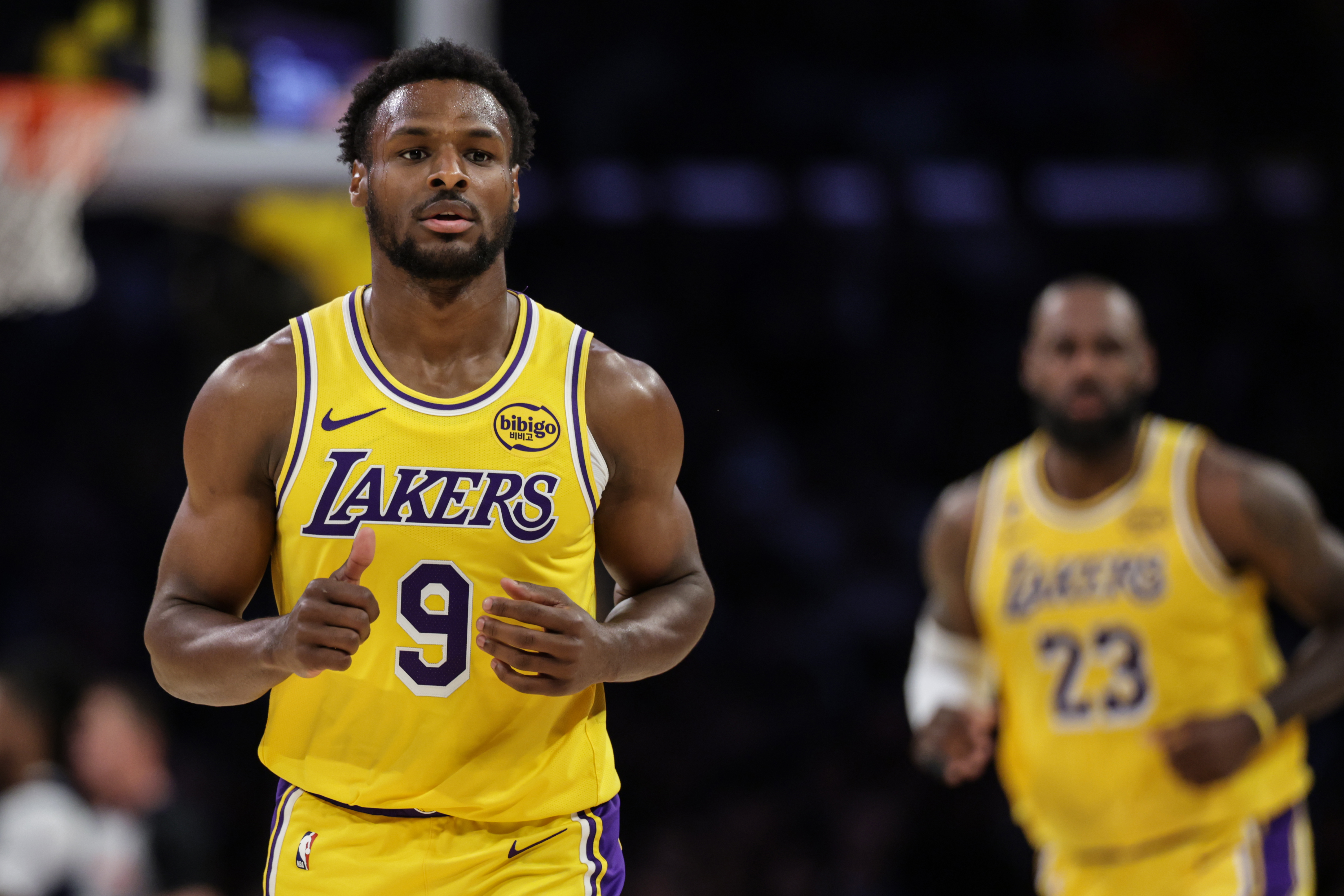 Bronny James hustles back on defense during a Lakers-Wizards game in March 2026. 