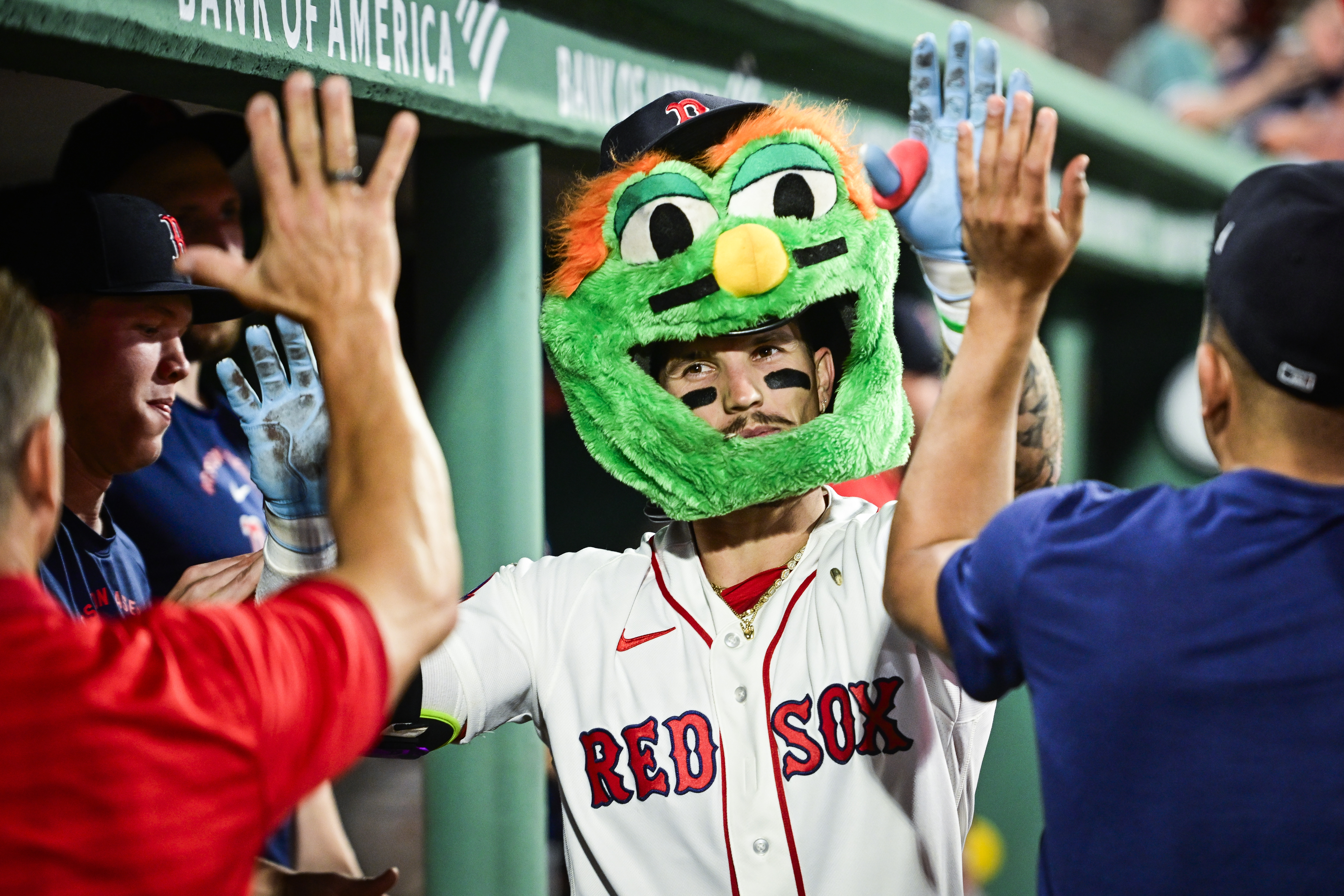 Jarren Duren and the Boston Red Sox celebrate a home run with a Wally helmet.