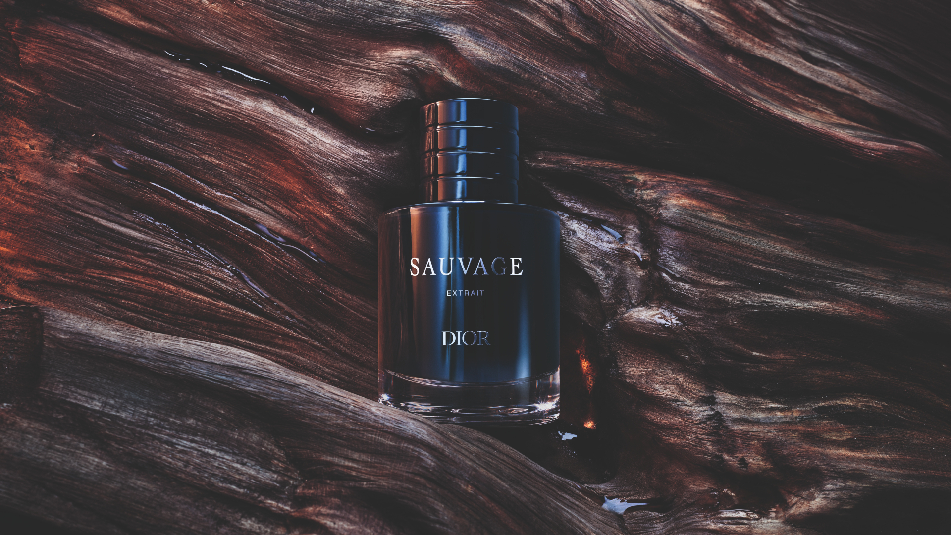 Dior Sauvage perfume bottle on textured dark wood background.
