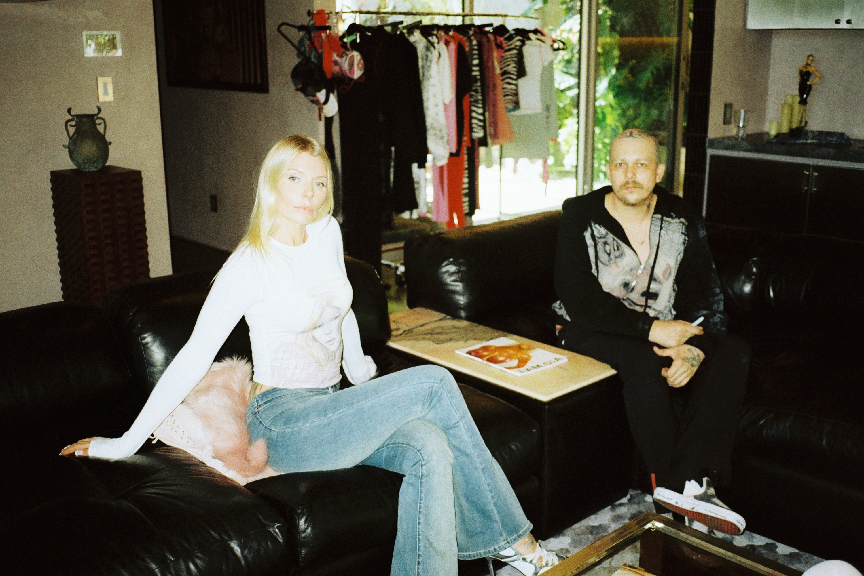 I.AM.GIA founder Alana Pallister and Los Angeles artist REX pose alongside items from their collaboration and a mockup of their ComplexCon 2026 booth design.