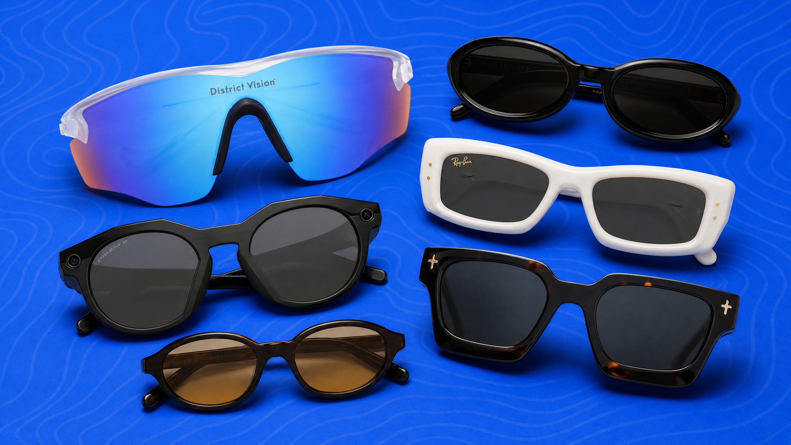 A collection of six sunglasses on a blue background, including brands like District Vision and Ray-Ban. Various shapes and colors are displayed.