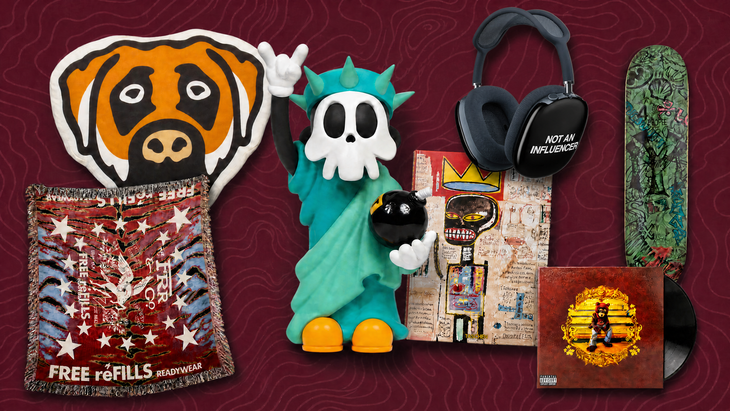 A collection of items including a dog face pillow, a Statue of Liberty figurine with a skull, headphones, artwork, a skateboard, and a vinyl record.