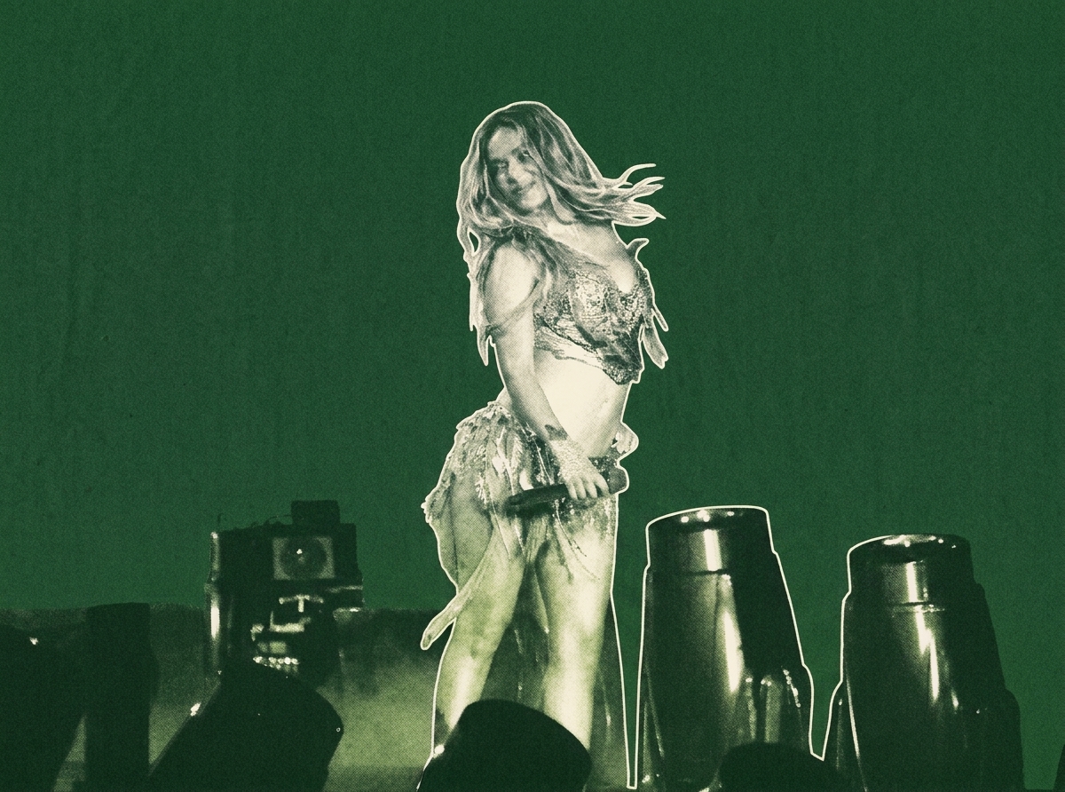Karol G on stage in a dynamic pose, holding a microphone, with a green background and stage lights.