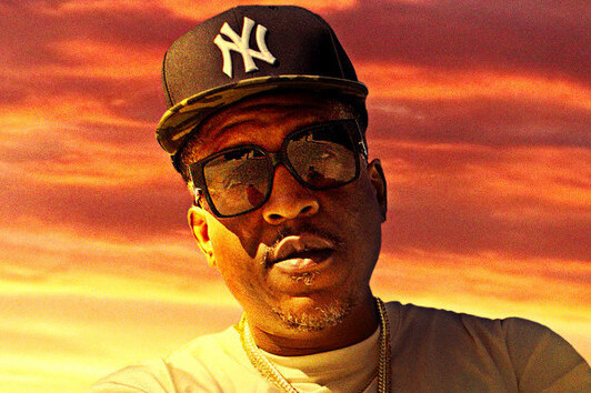 E.D.I. Mean headshot. he is a long time friend of Tupac, also known as 2Pac.