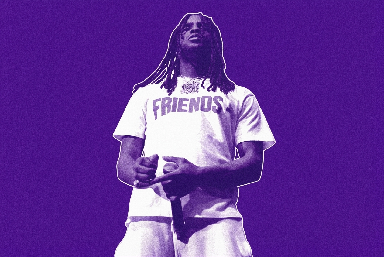 Chief Keef wearing a "FRIENDS" shirt, holding a microphone, with dramatic blue and white stage lighting.