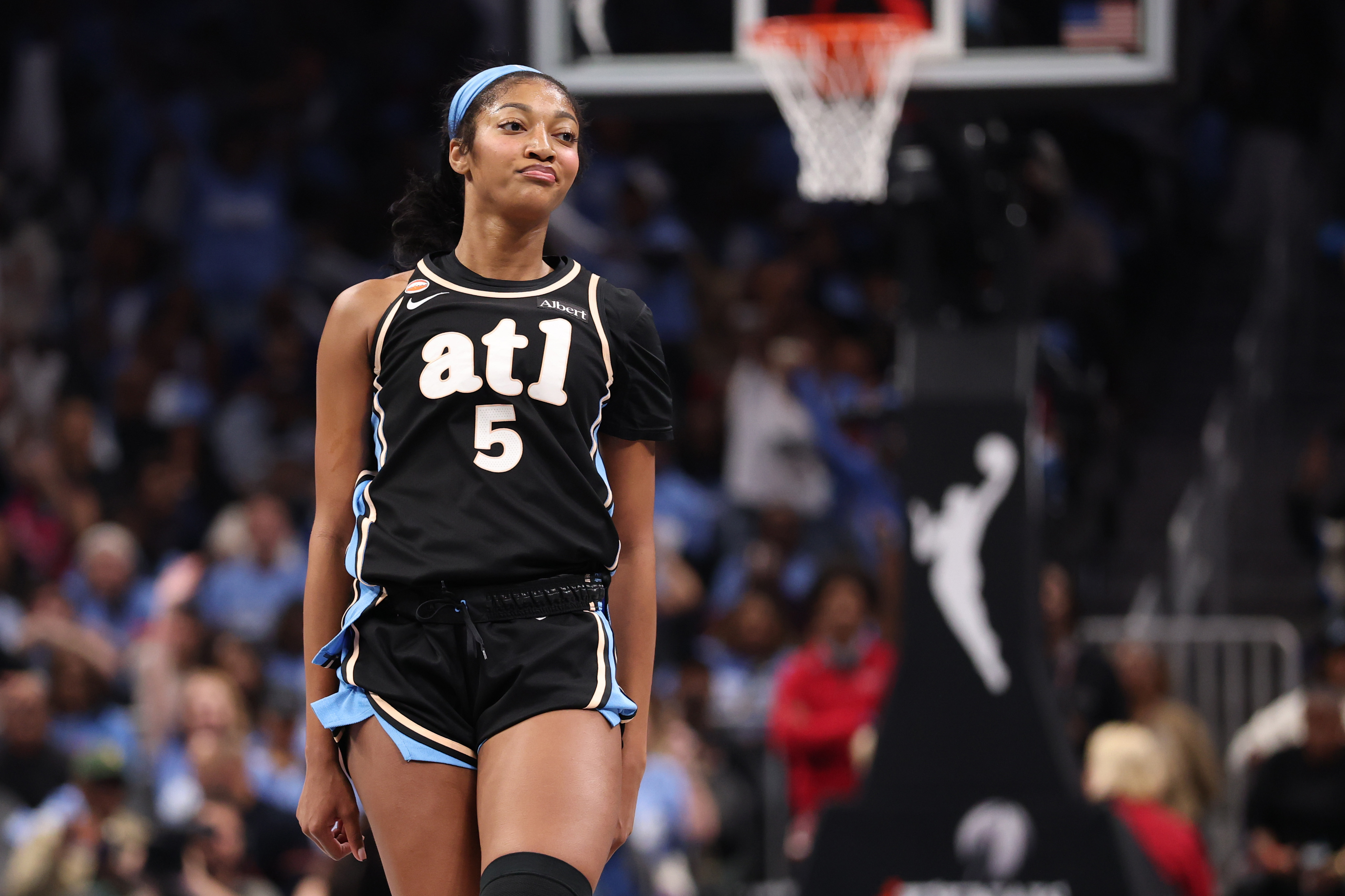 Angel Reese celebrates during Game 3 of the WNBA Finals. 