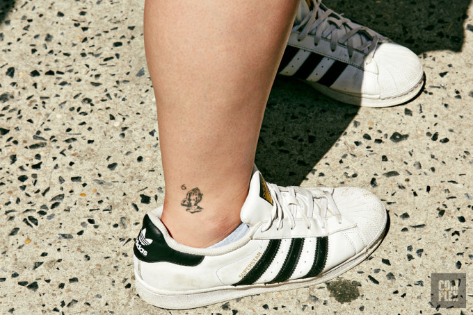 A fan shows off their Drake-inspired tattoo at the Summer Sixteen pop-up in New York.