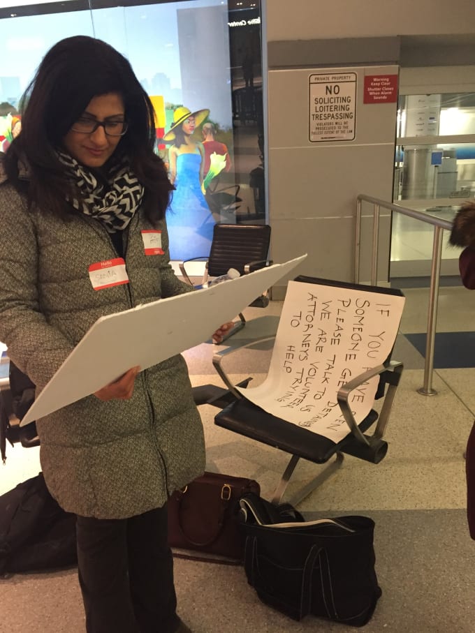 woman reading sign at jfk