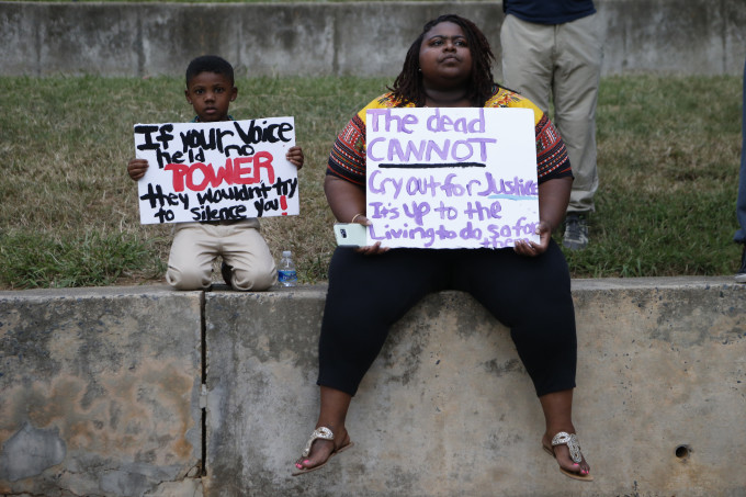 Residents gather for a vigil for Keith Lamont Scott.