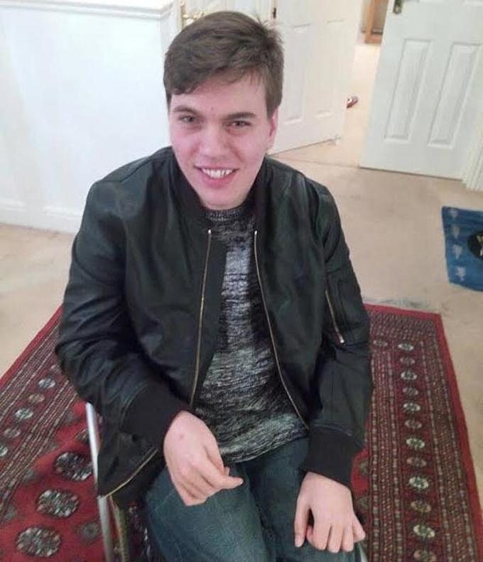 Alex Taylor in a leather jacket (and wheelchair)/ via The Telegraph