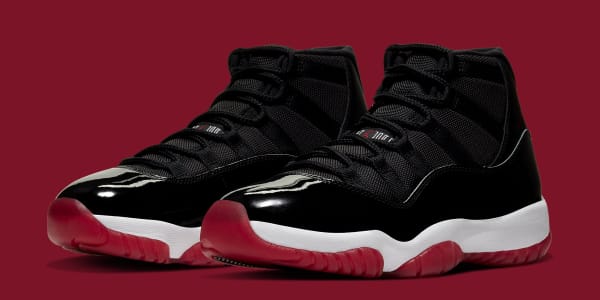 black and red jordan 11 bred