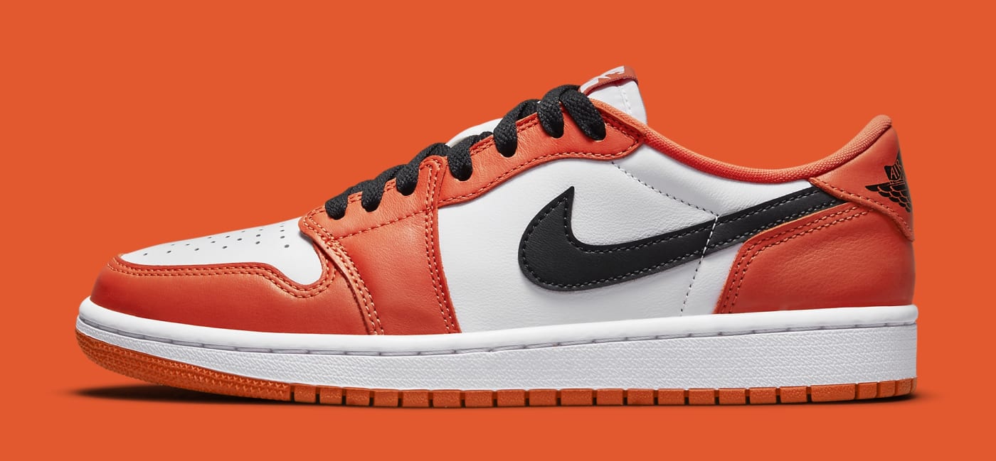 white and orange low top jordans